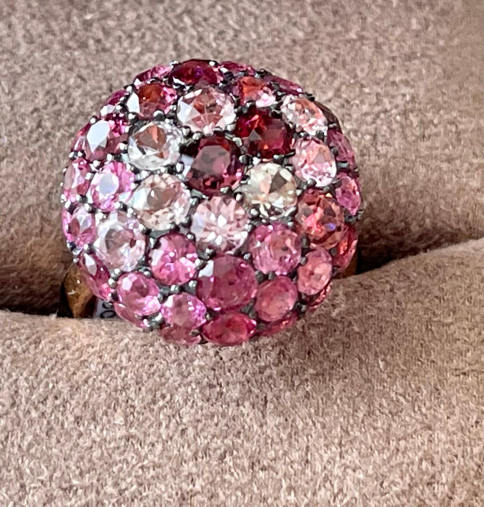 This fabulous Ccktail Ring in 18 K rose Gold is set with 55 Torumalines in all shades of pink and purple weighing 8.02 ct. The ring is set in a 