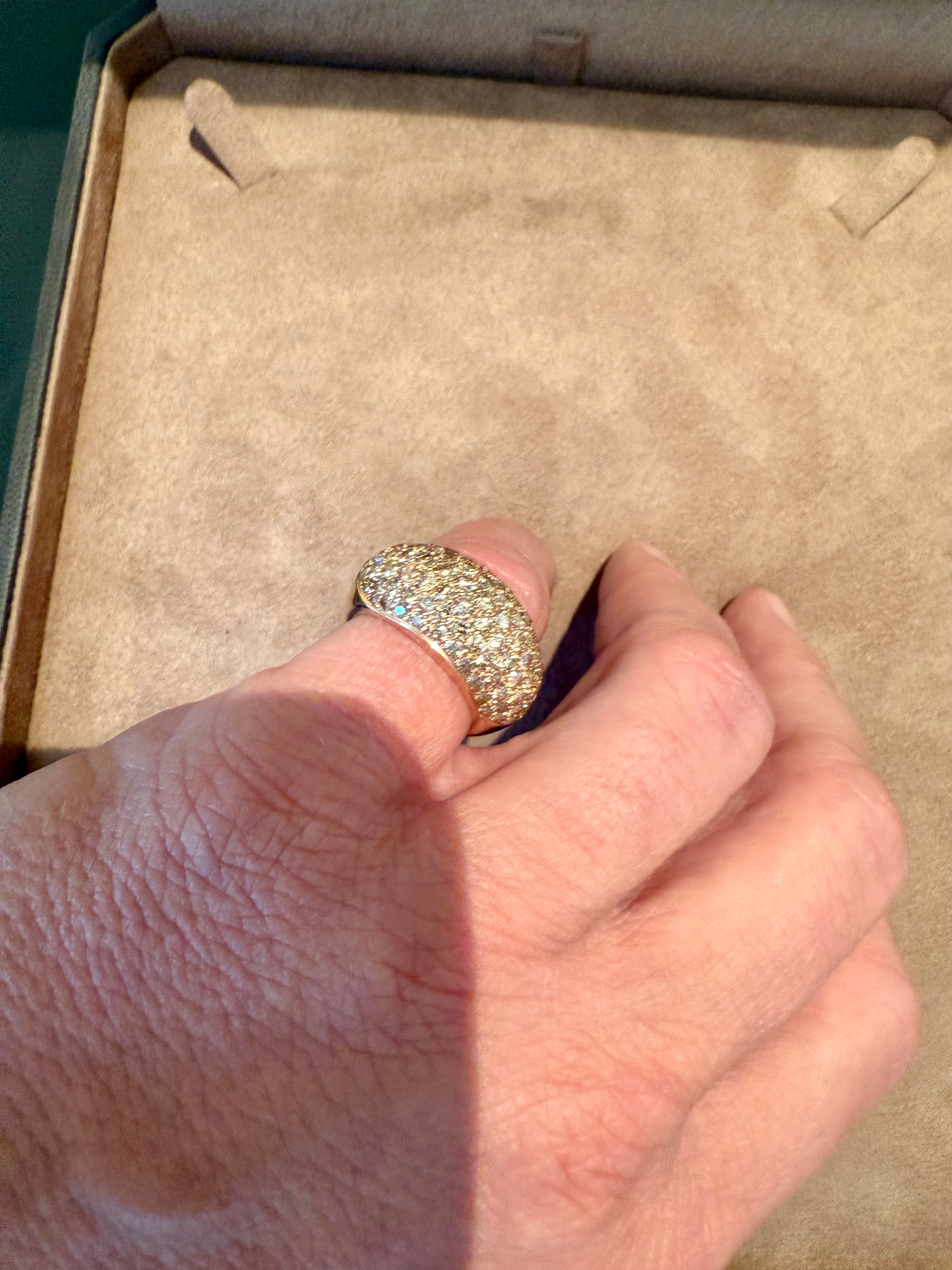 A sophisticated band ring crafted in 18K rose gold, adorned with 89 round brilliant cut Diamonds weighing 3.68 carats of brown diamonds in a refined pavé setting. The warm tones of the gold enhance the natural brilliance of the diamonds, creating a