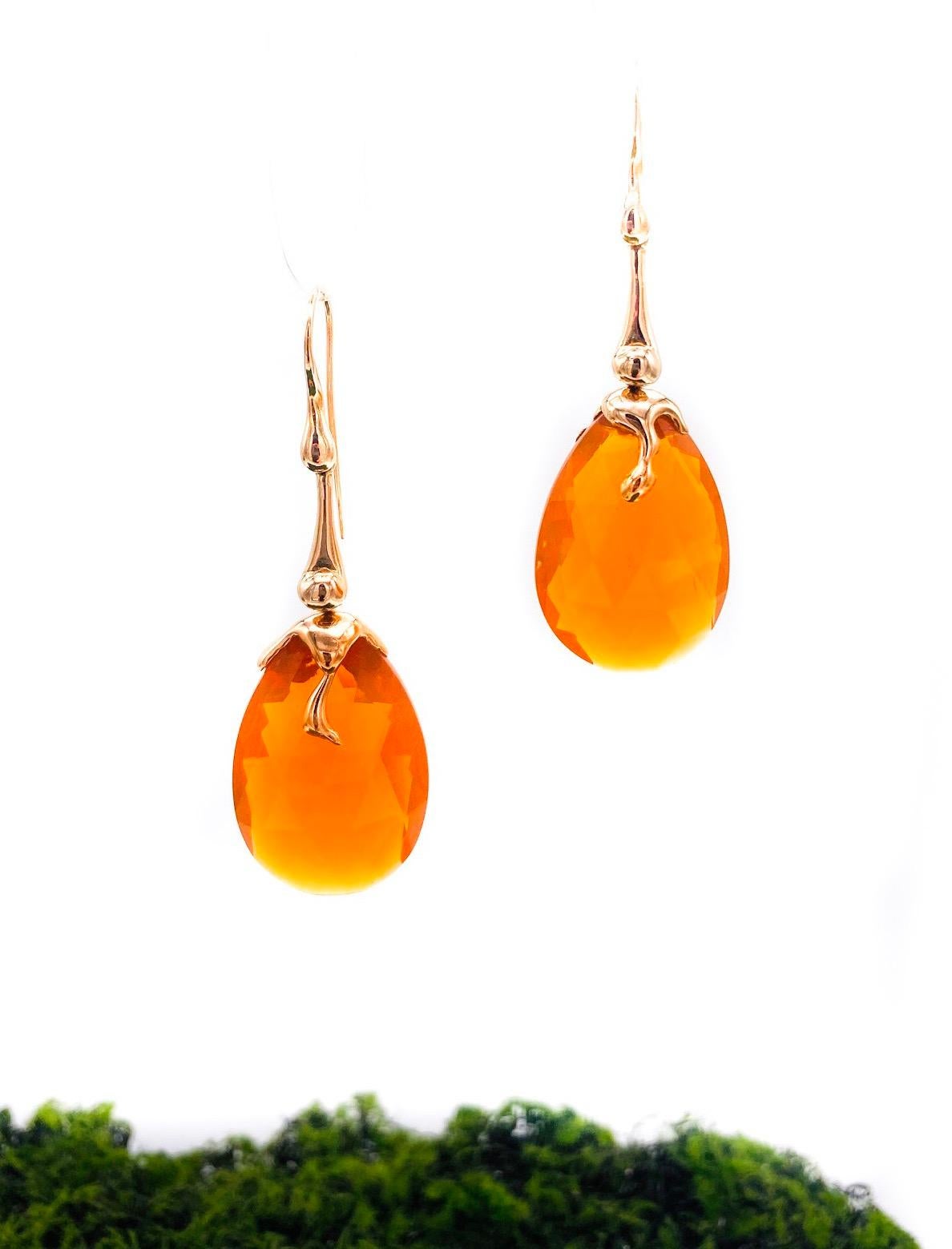 18 k rose gold earrings and fire Mexhican opal. The length of this dangle earrings  from hole to bottom is mm 60. 