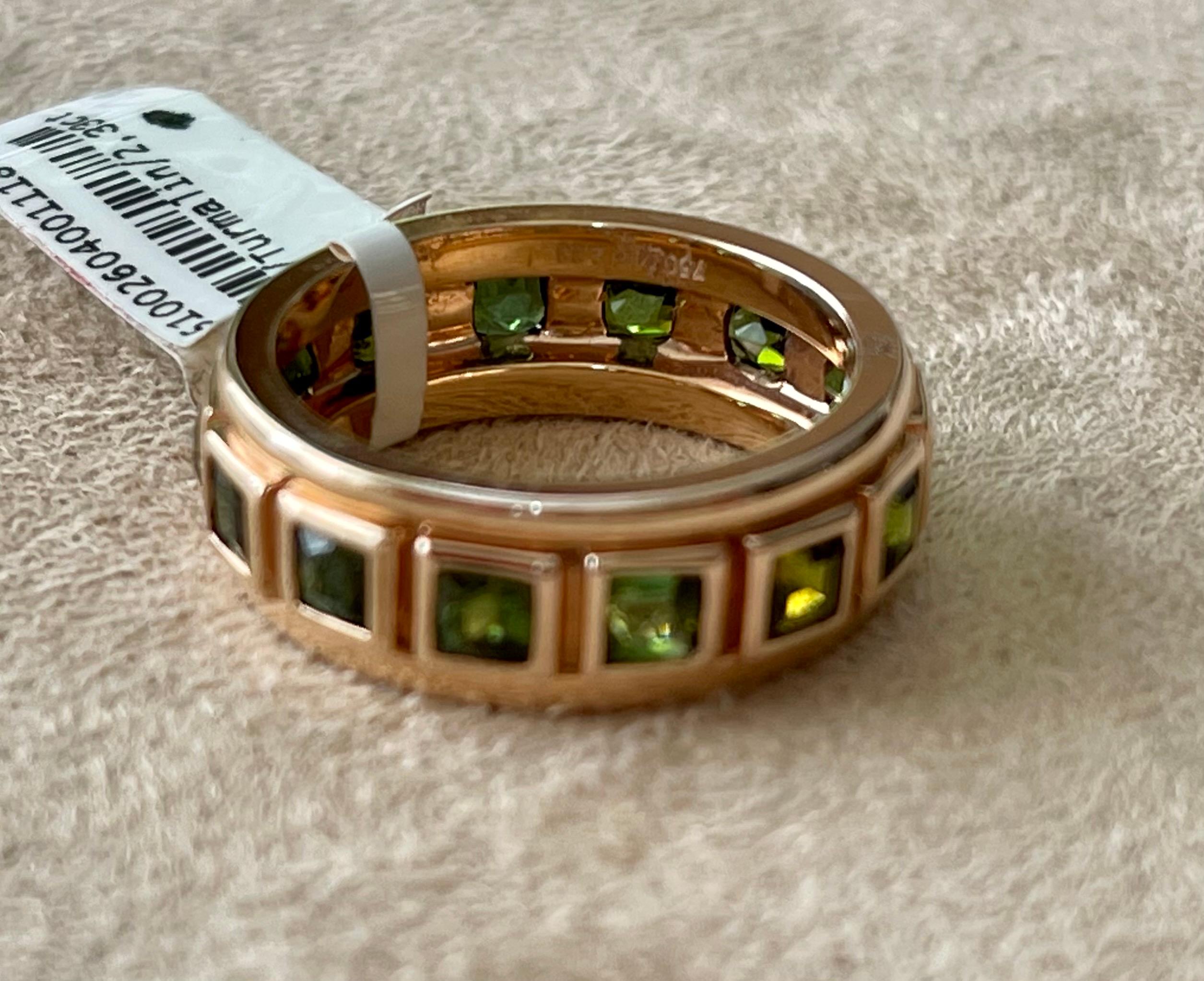 Solid 18 K rose Gold Eternity Ring set with 14 square cut pink Tourmalines weighing 2.33 ct in a solid bezel channel setting. 
Each  stone is faceted and well-matched in shape and color. Natural variations in hue and intensity add to the beauty of