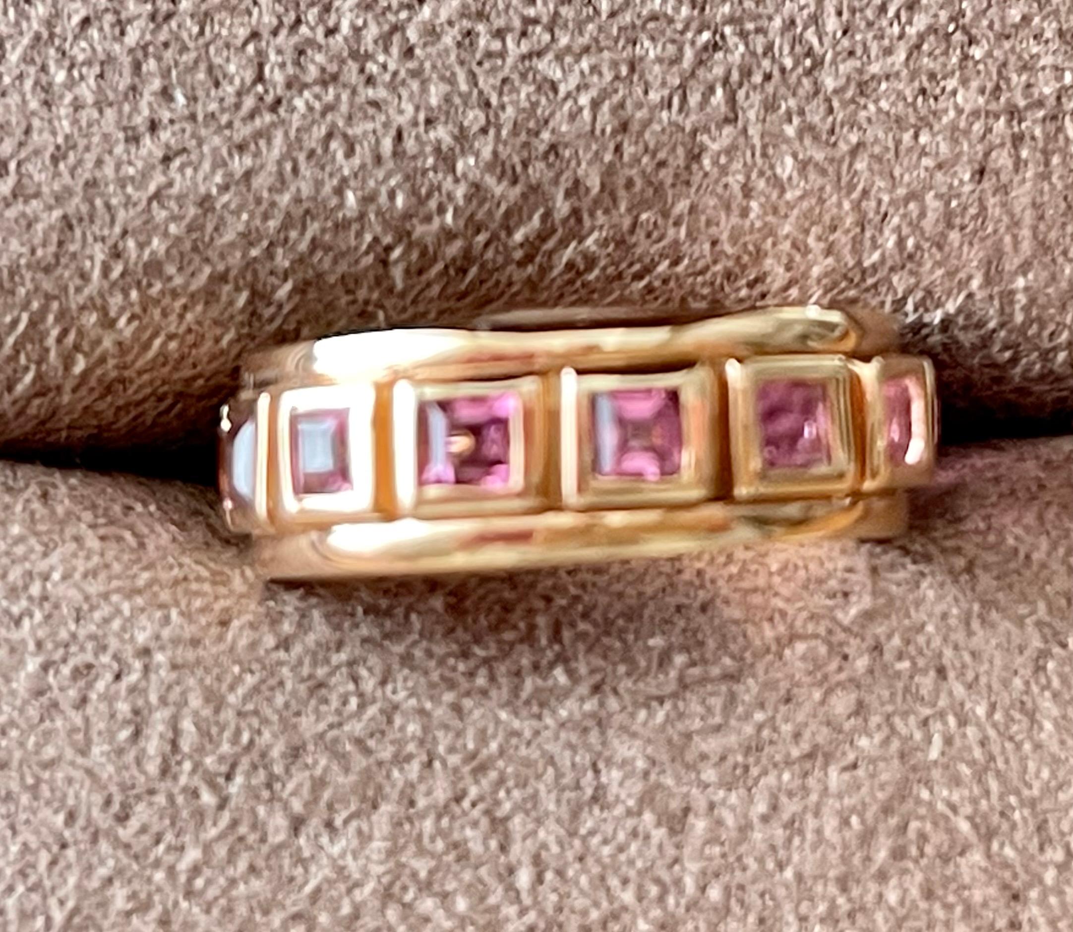 Solid 18 K rose Gold Eternity Ring set with 14 square cut pink Tourmalines weighing 1.63 ct in a solid bezel channel setting. 
Each  stone is faceted and well-matched in shape and color. Natural variations in hue and intensity add to the beauty of
