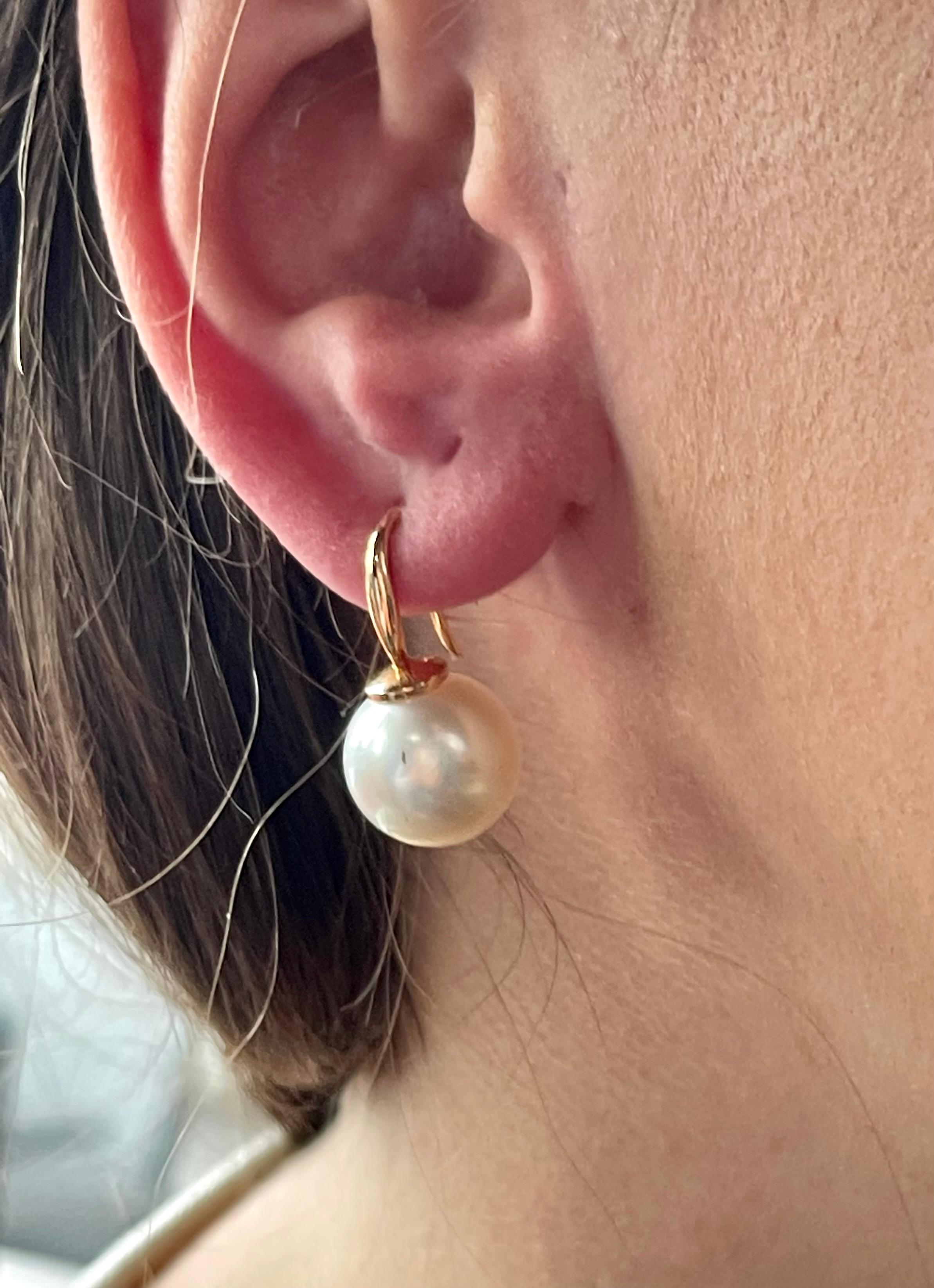 Pure simplicity these lovely 18 K rose Gold drop South Sea Pearls earrings. The pearls measure 12.7 mm in diameter and have a nice lustre. Also available in 18 K white Gold. 
Masterfully handcrafted piece! Authenticity and money back is guaranteed.