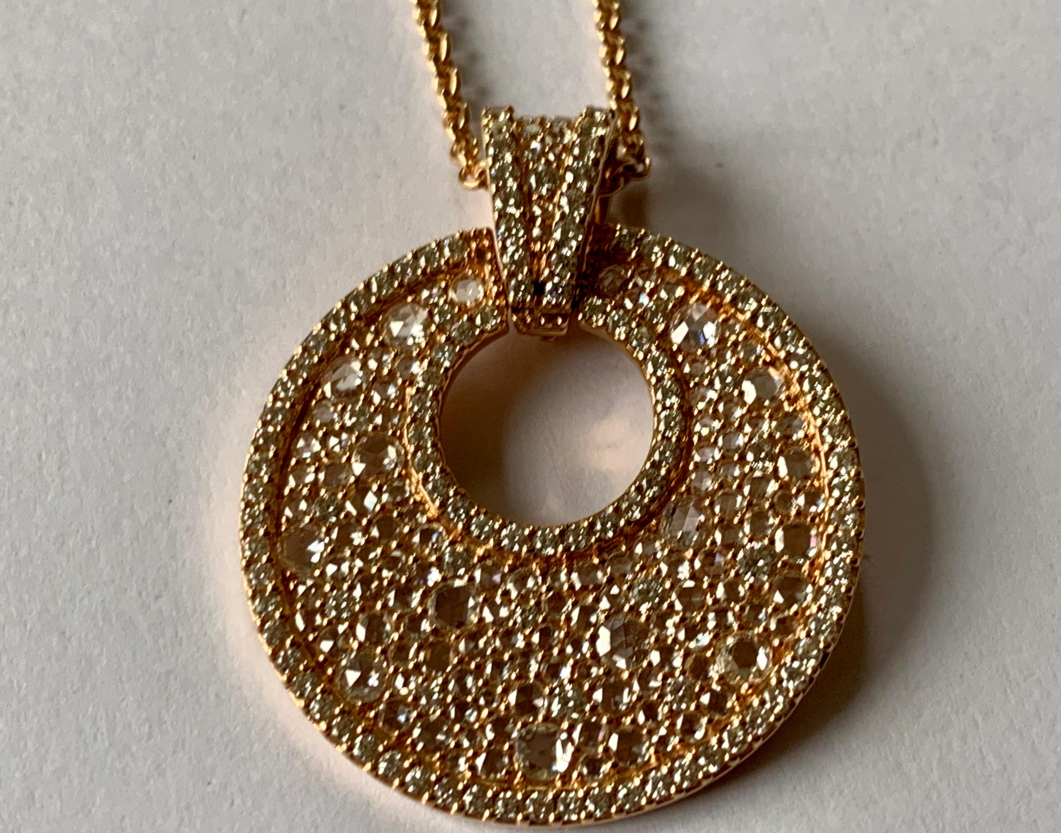Lovely 18 K Rose Gold pendant with chain. Pendant set with 253 brilliant cut and rose cut Diamonds with a total weight of 3.13 ct. 
Chain: 42 cm
A lovely and playful 18 K yellow Gold charm bracelet with Rose Quartz and Amethysts and Prasiolite. 
A
