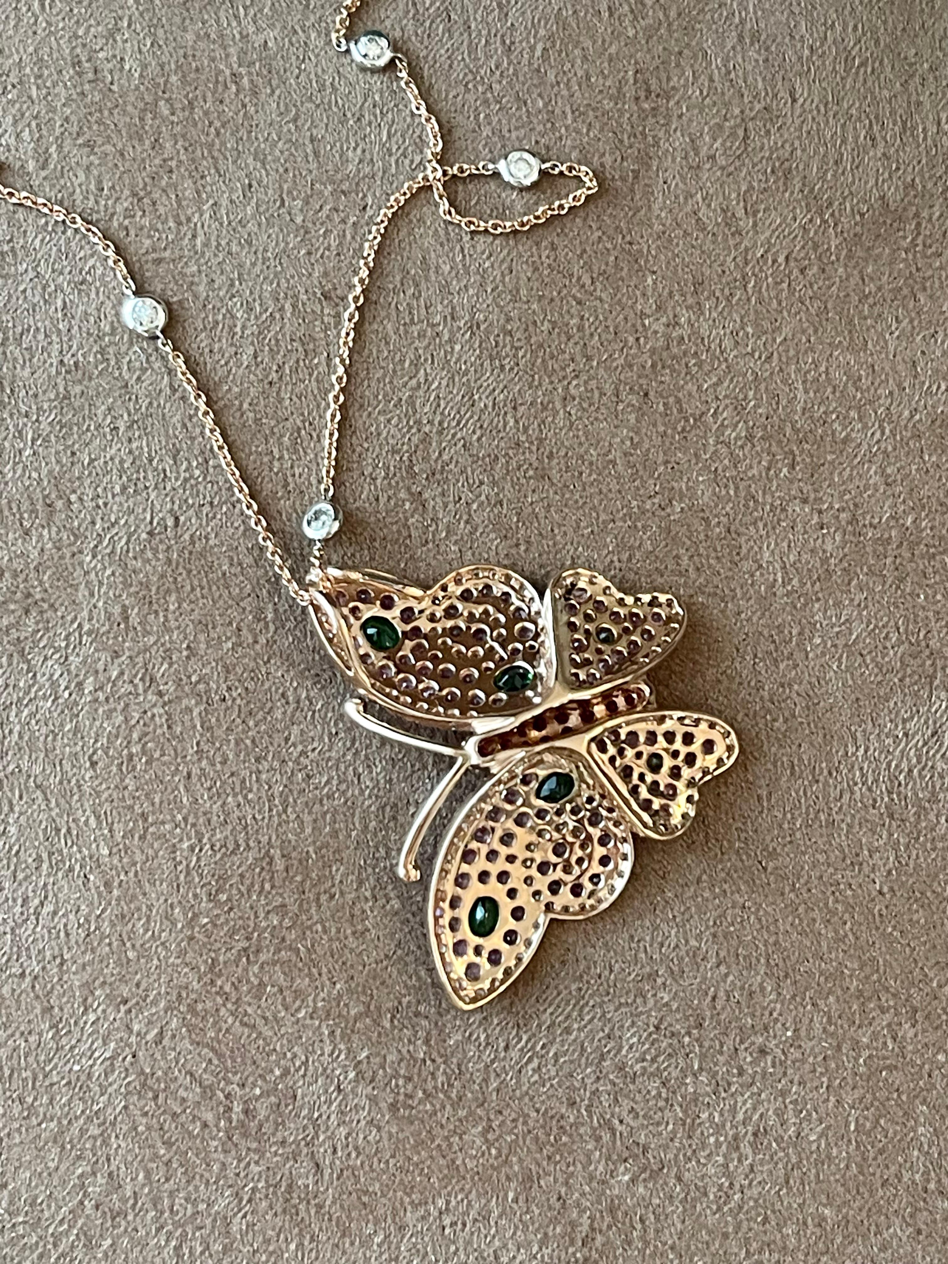 Fantastic 18 K rose Gold Butterfly pendant with chain. This butterfly is ready to take a flight covered with precious gems. The butterfly is covered with 29 pave set Rubies 0.53 ct, 106 pink Sapphires 1.65 ct, 6 vivid green Tsavorites 0.40 ct and