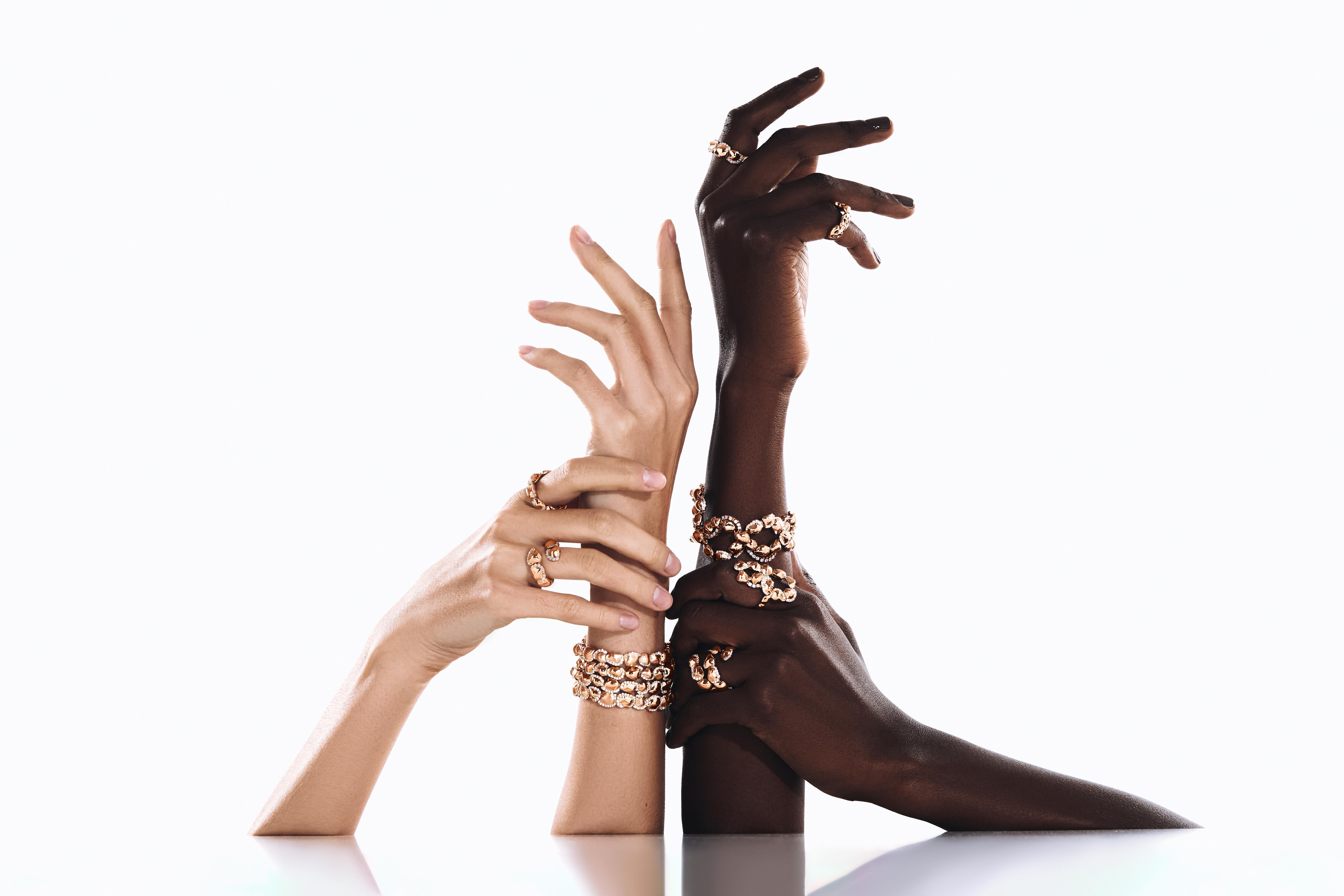 An elegant expression of contemporary craftsmanship, this Sarab bangle is sculpted in radiant 18K rose gold, featuring a rhythmic sequence of textured, organic bead-like forms. Adorned with 1.06 carats of brilliant-cut diamonds nestled between the