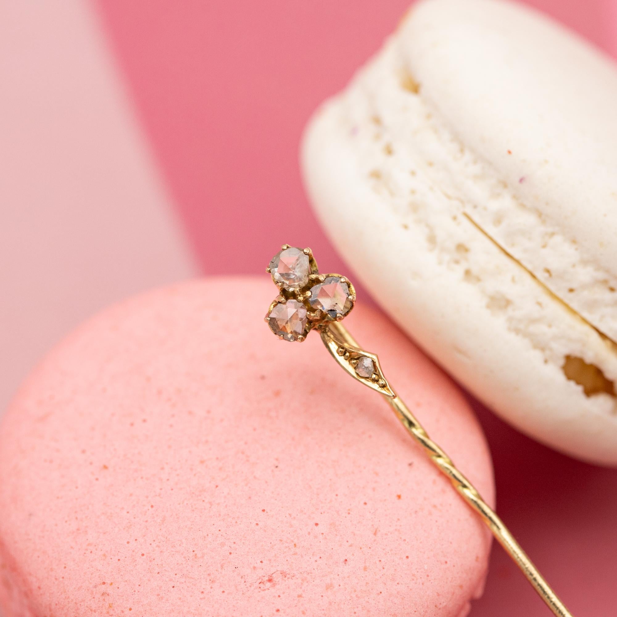 For sale is this stunning Victorian clover pin. This lovely antique 18 karat pinkish gold gold pin is set with four rose cut diamonds. The diamonds are set as if they are the three leafs of the clover. These lovely diamonds are not of the best