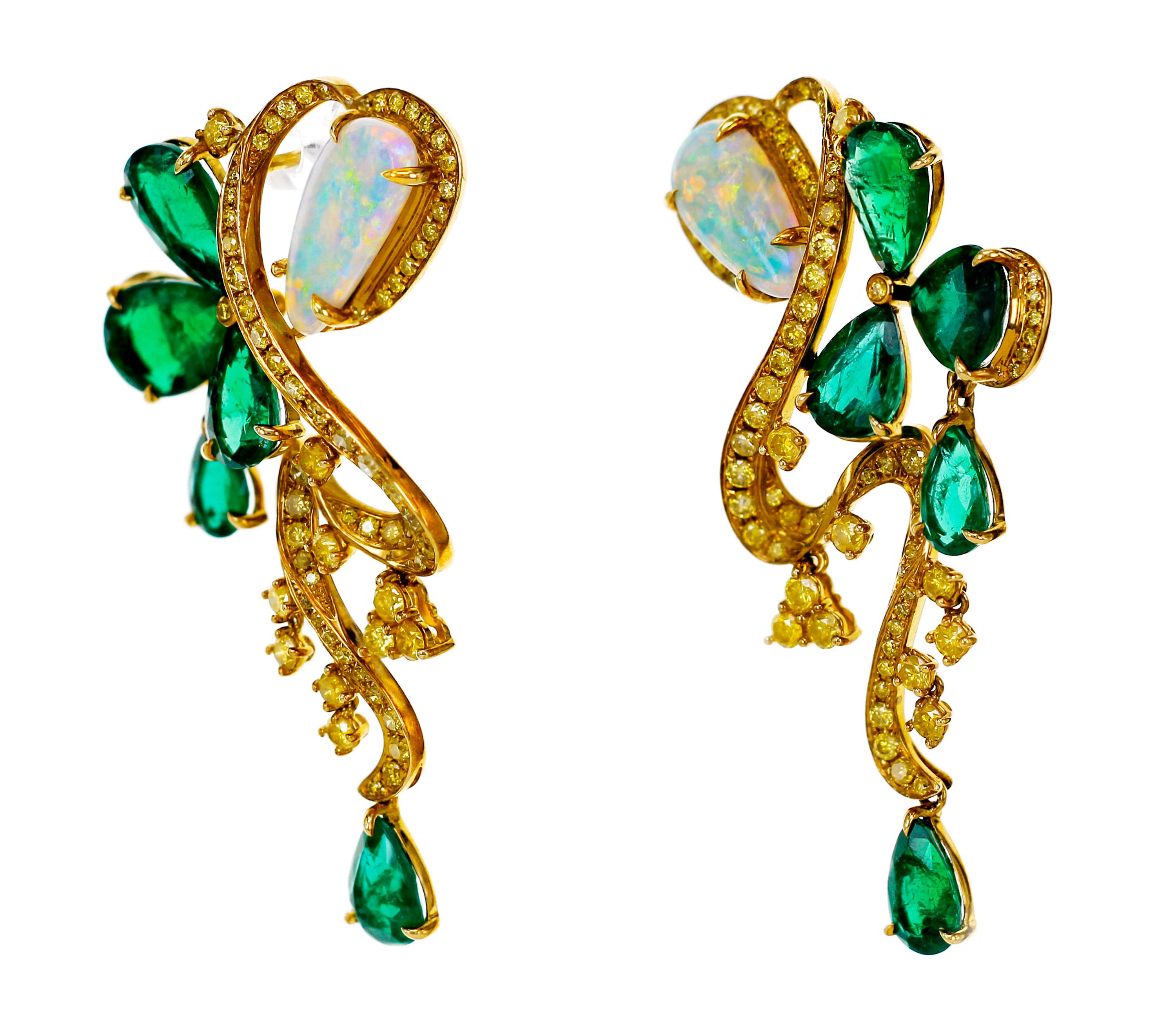 9.27 carat of vivid green Zambian emerald with 2.63 carat of Ethiopian Opal are set in this one of a kind cocktail dangle earring.
1.98 carat of vivid yellow round brilliant natural diamond are also to make this earring stand out from rest of the