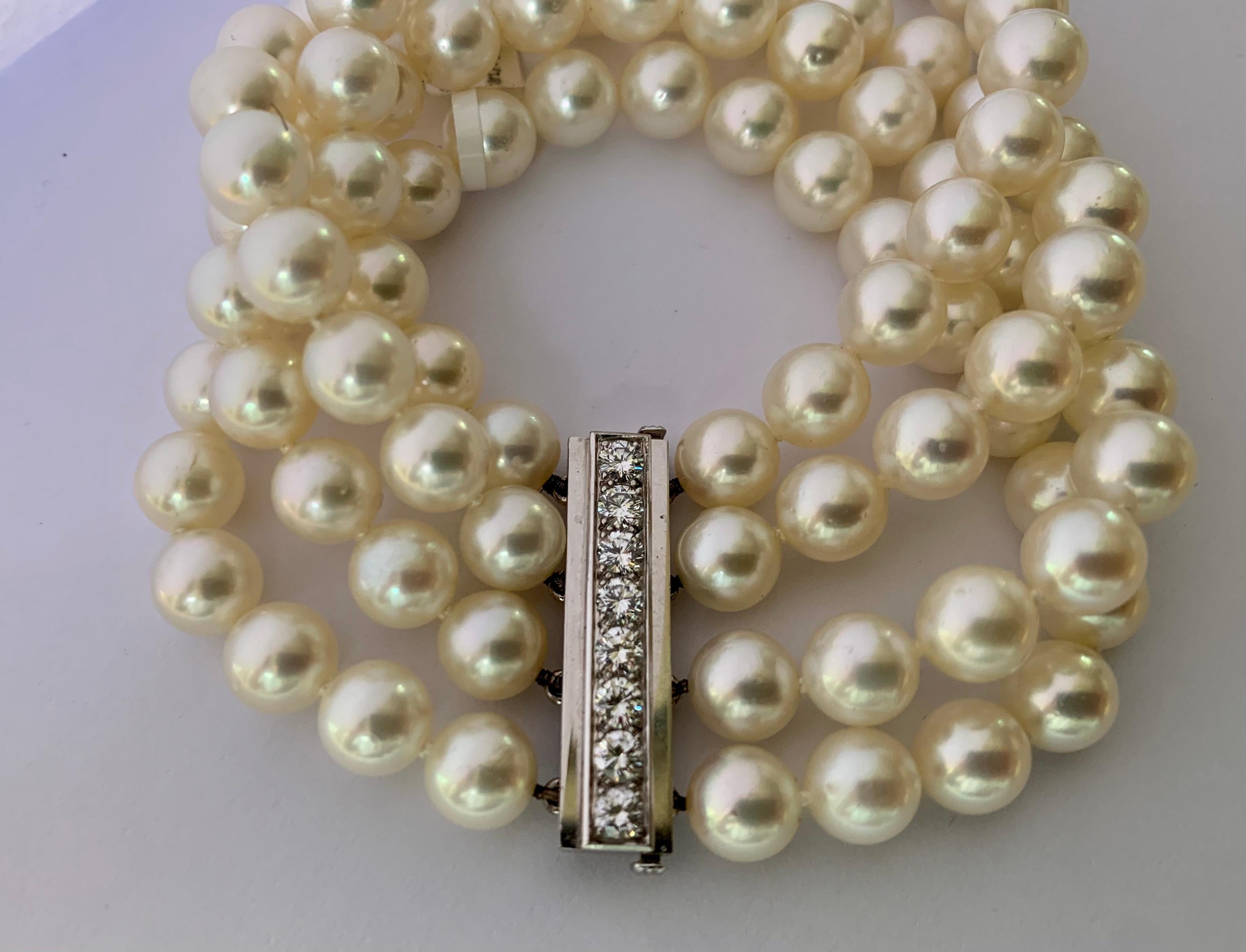 69 white cultured  Akoya pearls, measuring 7.5mm-8.00mm each, are strung on four rows of this lovely bracelet. The linear 18 Karat white gold  clasp features 8 round brilliant cut diamonds, weighing ca. 1.20 ct, F color, vs clarity.  The bracelet
