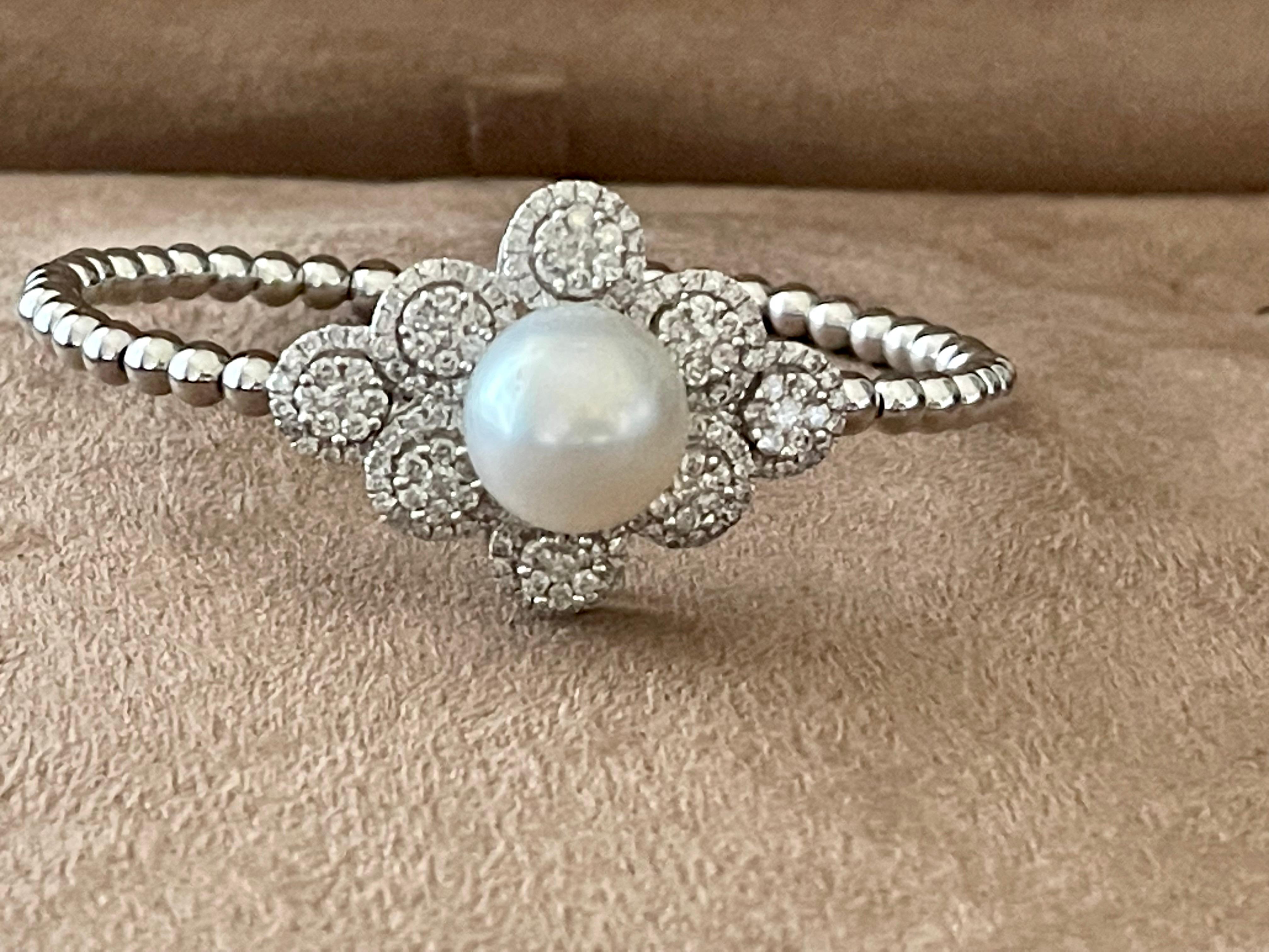 Lovely 18 K white Gold bangle featuring a fine white South Sea Pearl (13.3mm) and 156 brilliant cut Diamonds weighing 2.20 ct. The bangle is flexible and matches small to mediums wrists. 
QUESTIONS?  Contact us right away if you have additional