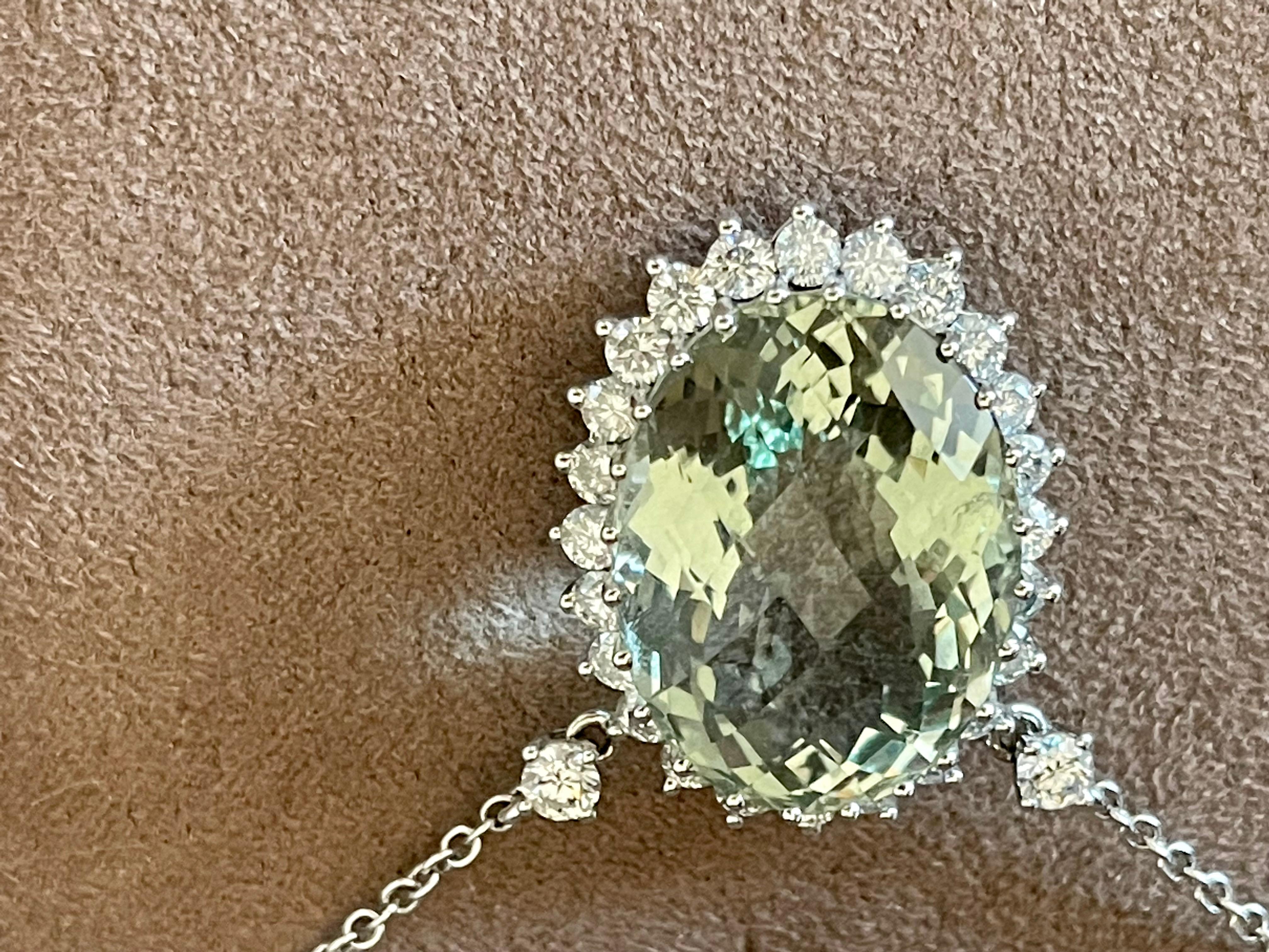 Timeless and classy 18 K white Gold chain with a fancy cut oval mint green Beryl weighing 25.91 ct in a Diamond surround. The 28 brilliant cut Diamonds have a total weight of 2.12 ct, G color, vs clarity. 
Length of the necklace: 42 cm.
Dimensions