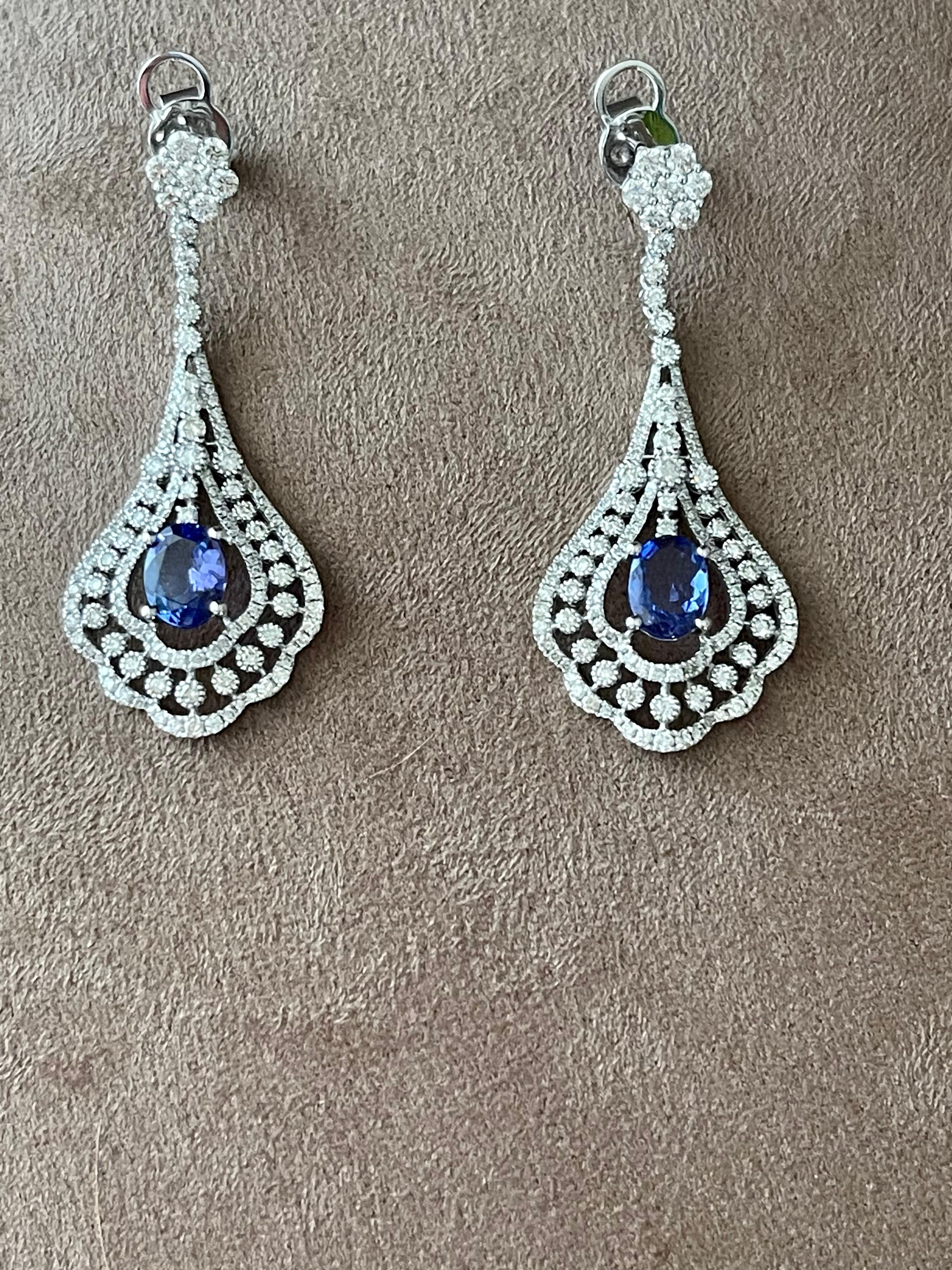 A pair of very elegant 18 K white Gold Chandelier earrings featuring 2 oval shape Tanzanites weighing 2.19 ct and 276 brilliant cut Diamonds weiging 2.38 ct. 
Dimensions: 5.0 cm x 1.90 cm.  Weight: 9.08 grams. 
QUESTIONS?  Contact us right away if