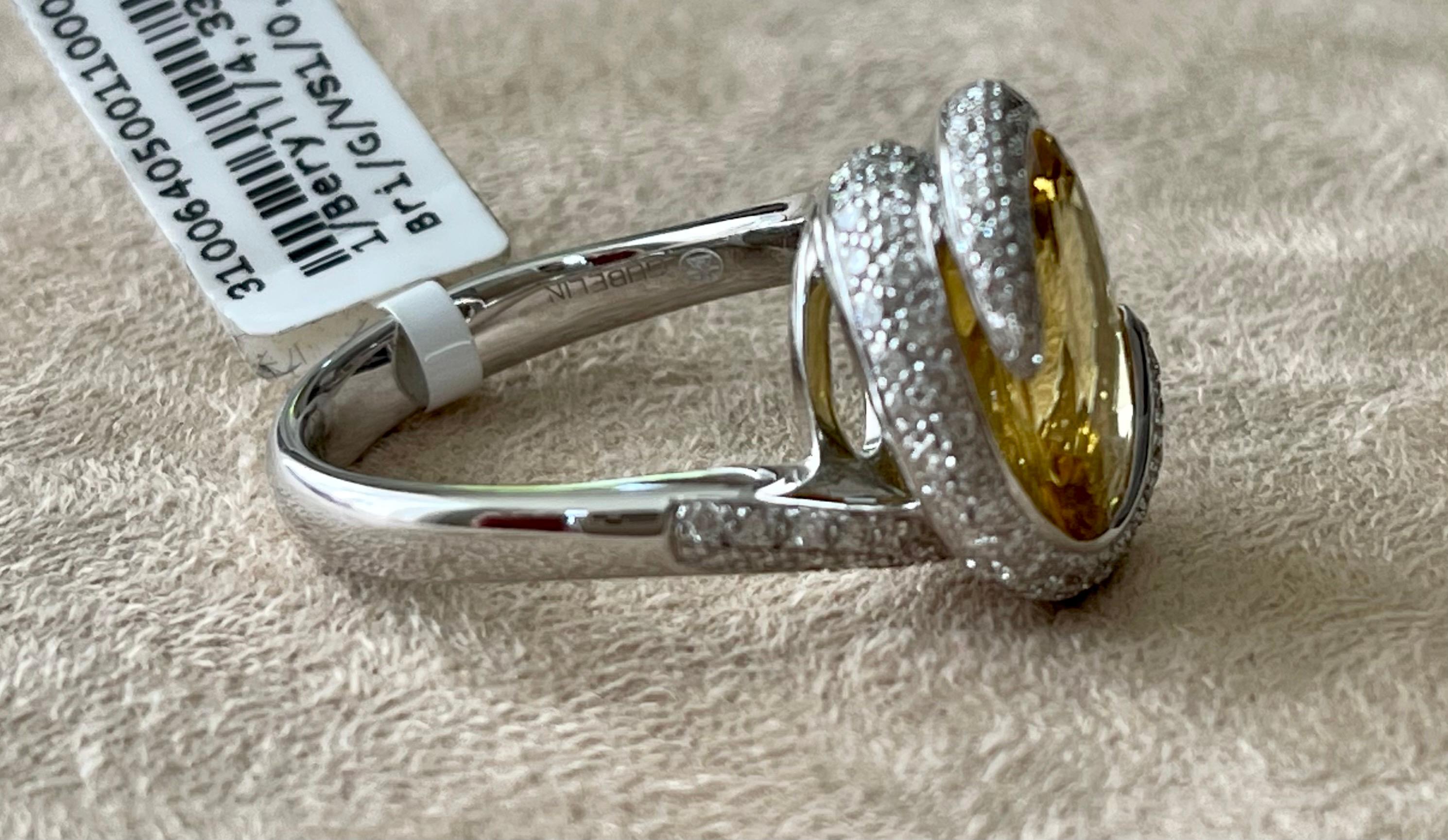 This fabulous Cocktail Ring in 18 K white Gold features a vivid yellow oval Beryl weighing 4.33 ct and is modernly surrounded by brilliant cut Diamonds with a total weight of 0.89 ct. It is signed Gübelin Lucerne, Switzerland. Matching earstuds