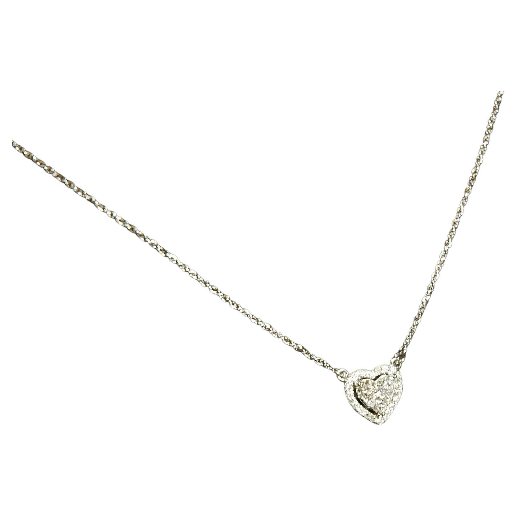 18 k white gold necklace with central heart with brilliant cut diamonds ct.0.65
