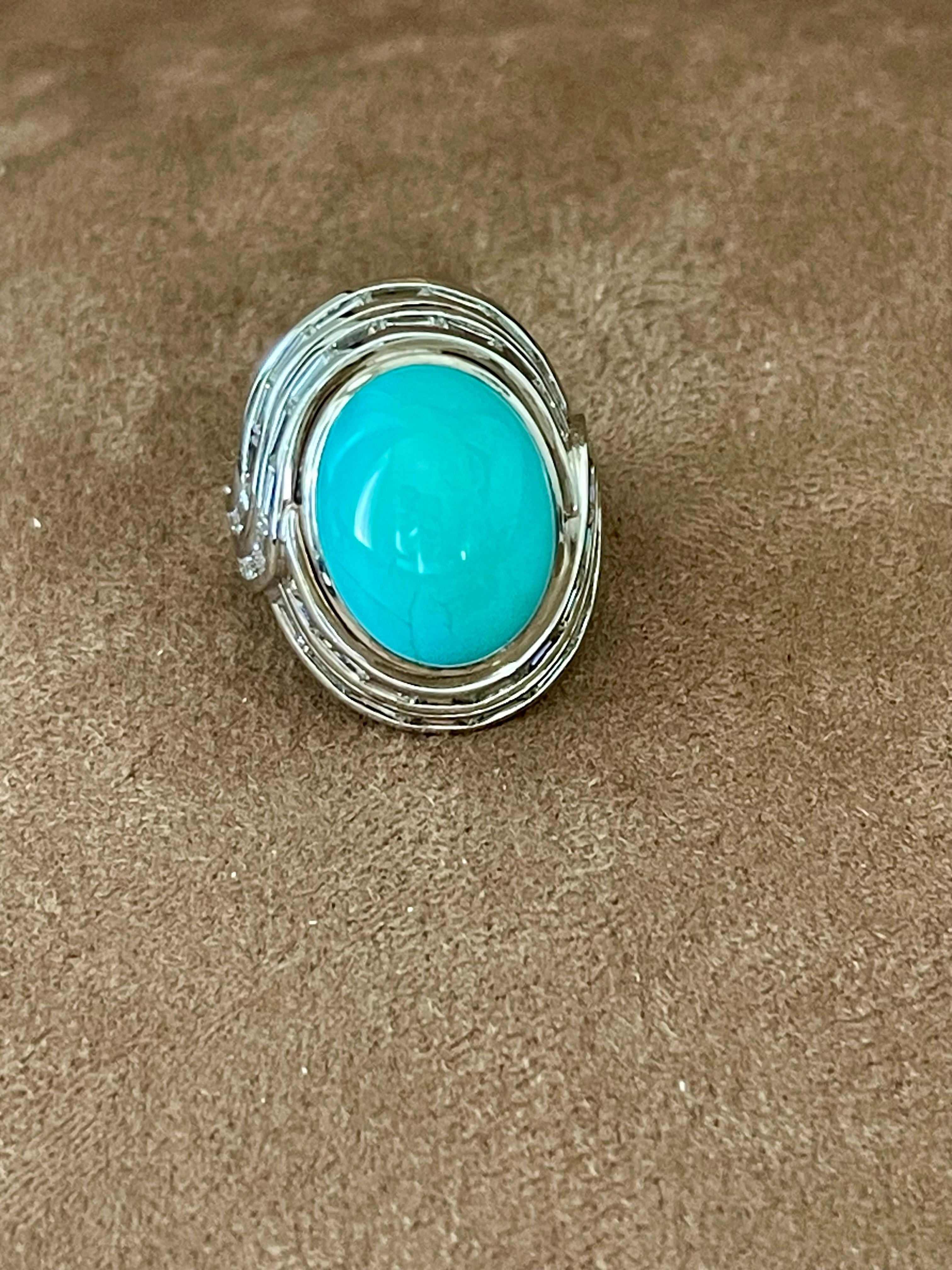 A timeless 18 K white Gold Ring by Paul Binder Zurich featuring a fine natural Turquoise Cabochon weighing 11.33 ct and 48 Baguette cut Diamonds weighing 2.24 ct, F/G color, if/vvs claritiy. 
Dimensions: 2.50 cm x 1.92 cm
The ring is currently size