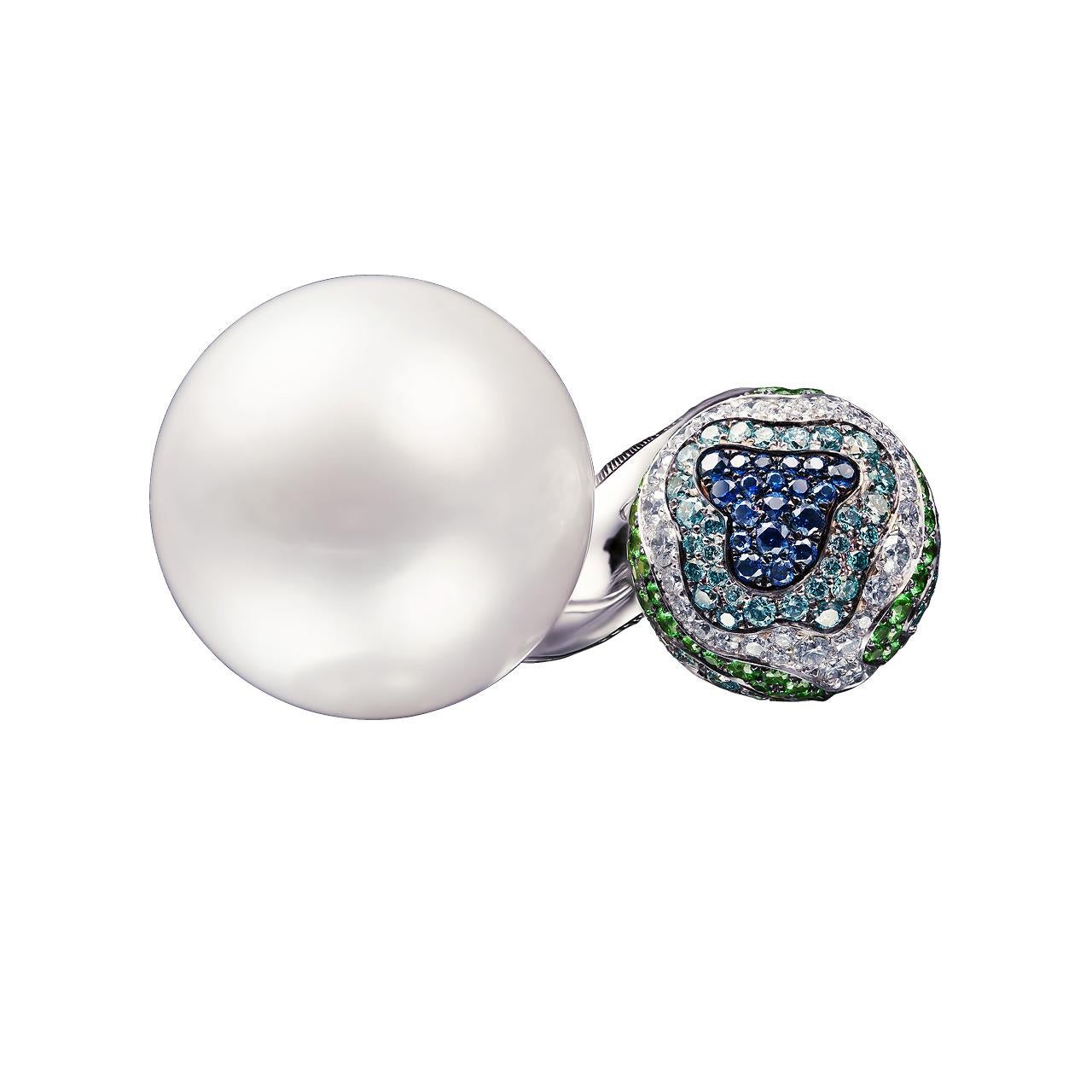 - 77 Round Diamonds – 0.65 ct, D-F/VVS
- 80 Round Blue Diamonds – 0.61 ct
- 66 Round Sapphires– 0.58 ct
- 67 Round Tsavorites– 0.60 ct
- 18.3 mm White South Sea pearl
- 18K White Gold 
- Weight: 19.79 g
- Size: 16.5 mm
This fabulous ring from the