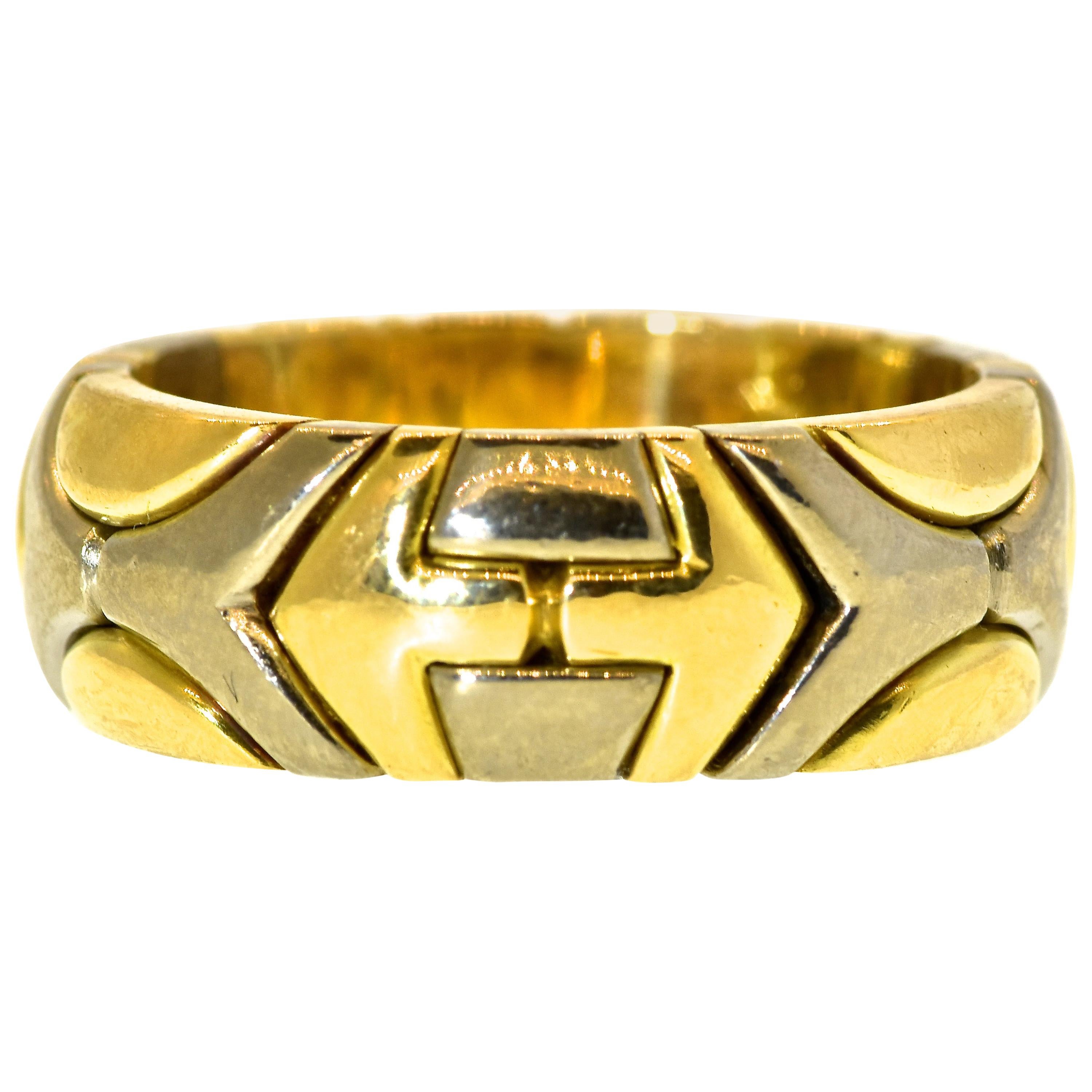 Ring band of 18K white and yellow gold, slightly rounded top,  in a contemporary design, but a vintage ring, weighing a hefty 15.9 grams.  This  band ring is of Bulgari type but bears no marks  -probably because it was sized at some time in the