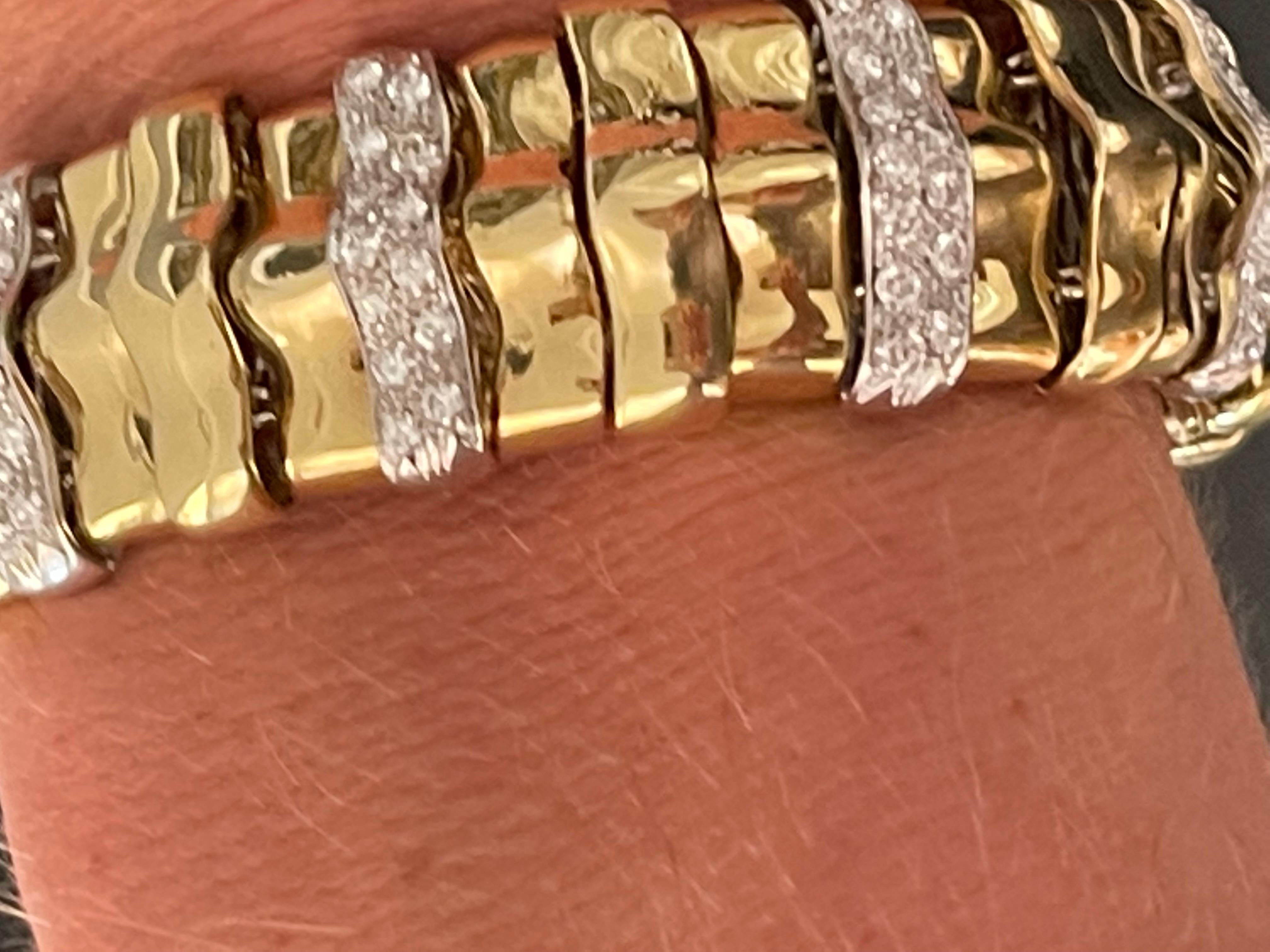 18 K yellow and white Gold Vintage Bracelet set with 126 brilliant cut Diamonds weighing apprxintely 2.80 ct, H color, vs clarity.
Width: 2.04 cm and 20.5 cm length, 72.83 grams.
Masterfully handcrafted piece! Authenticity and money back is