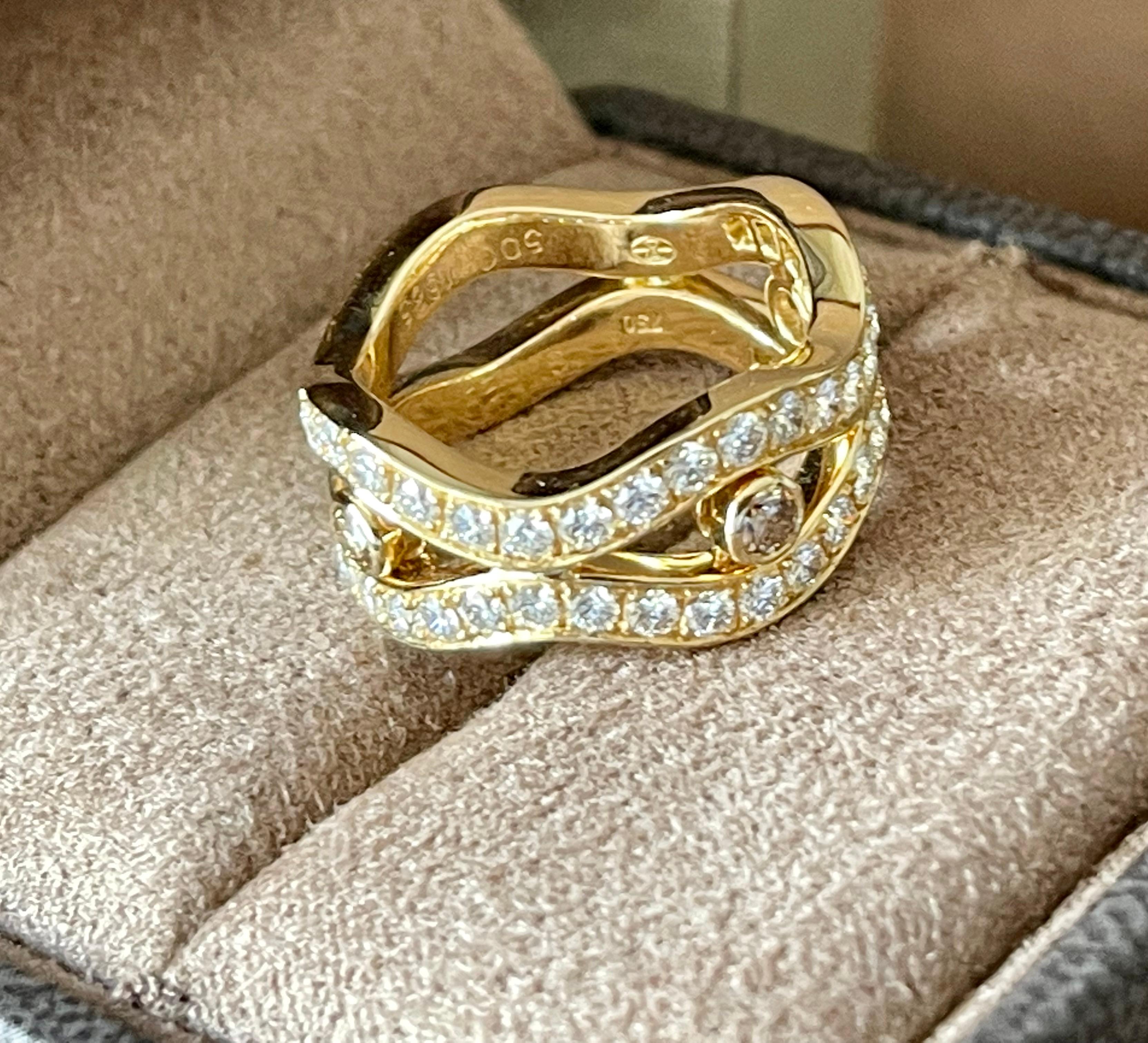 Timeless and elegant 18 K yellow Gold Band Ring featuring 38 brilliant cut Diamonds weighing 1.34 ct, G color, vs clarity and 3 brown brilliant cut Diamonds weighing 0.25 ct. Signed Gubelin Lucerne. 
The ring is currently size 55/15 ( american Ring
