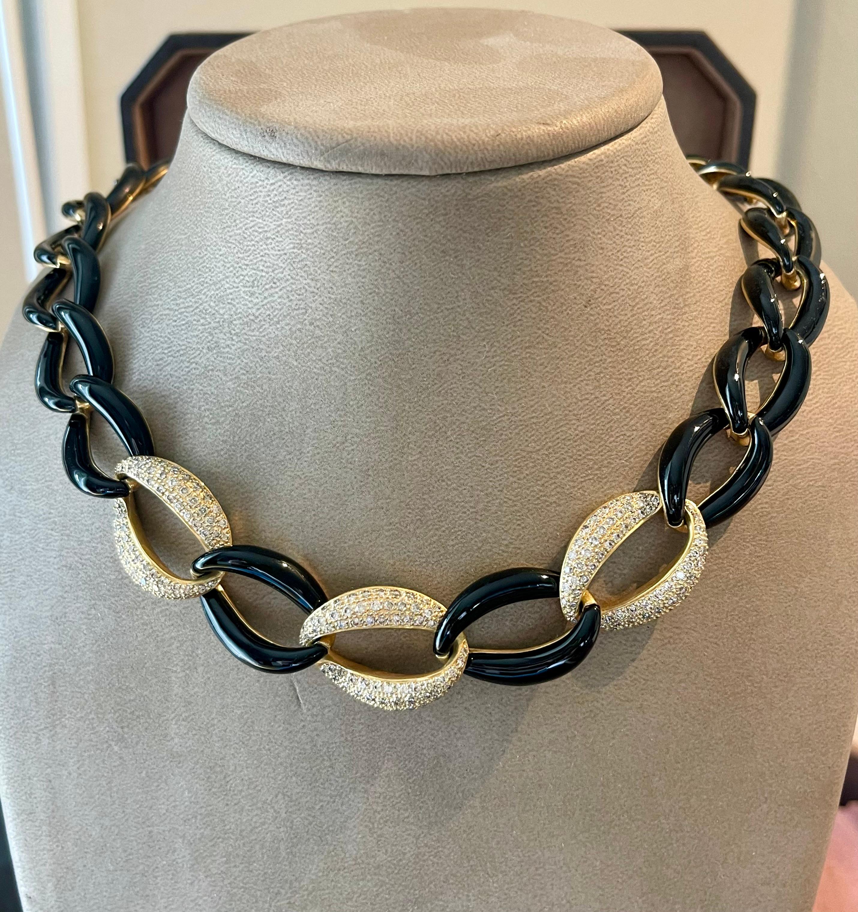 A timeless 18 K yellow Gold black Enamel Diamond necklace. 3 links are pave set with brilliant cut Diamonds. 
The link design features polished gold interwoven with black enamel accents, creating a striking juxtaposition of light and dark. The warm
