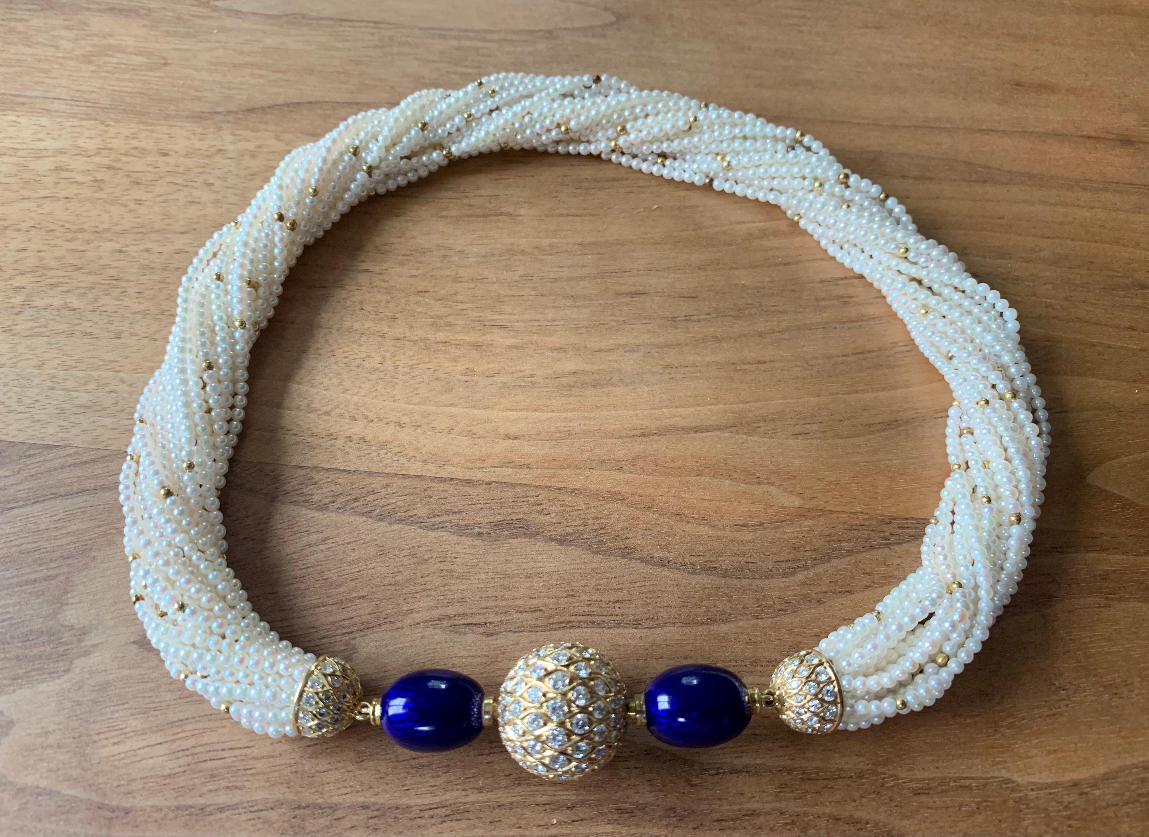 A classic tornado necklace consisting of 20 rows of cultured pearls with a removable 18 K yellow Gold ball clasp (can be used as a clasp for other necklaces) set with 135 brilliant cut Diamonds weighing 4.80 ct, F color, vvs. The 20 rows of Pearls