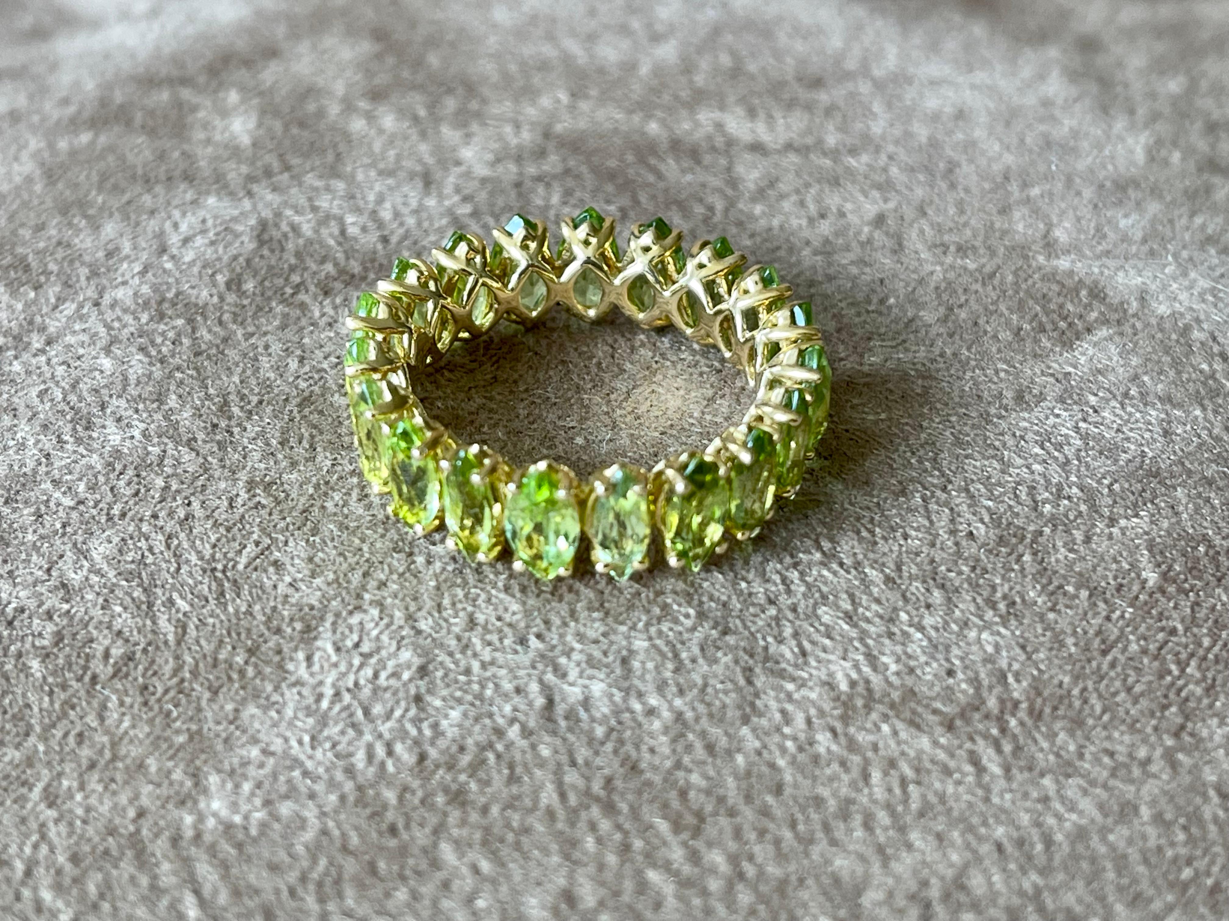 Contemporary 18 K Yellow Gold Marquise Peridot Eternity Band Ring For Sale