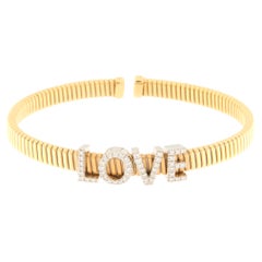 18 K Yellow Gold Semi-Rigid Bracelet with LOVE Writing in Diamonds Ct.0.30