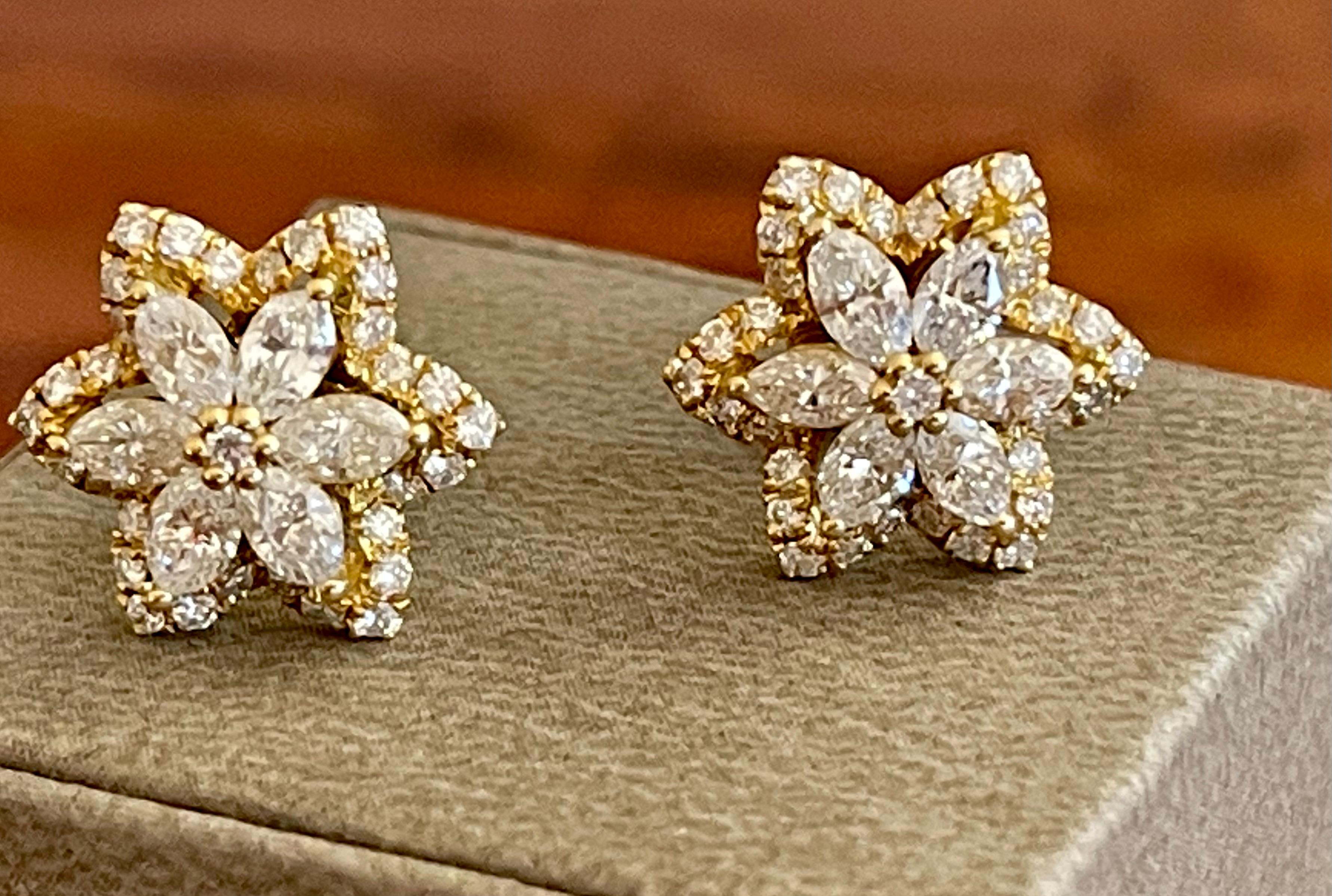 Lovely diamond starflower earrings for any occasion. Crafted in 18 K yellow Gold and set with 74 brilliant cut and marquise cut Diamonds weiging 1.98 ct. H color, si clarity. Posts with a heavy push backs will keep these secure in place. 
Width: