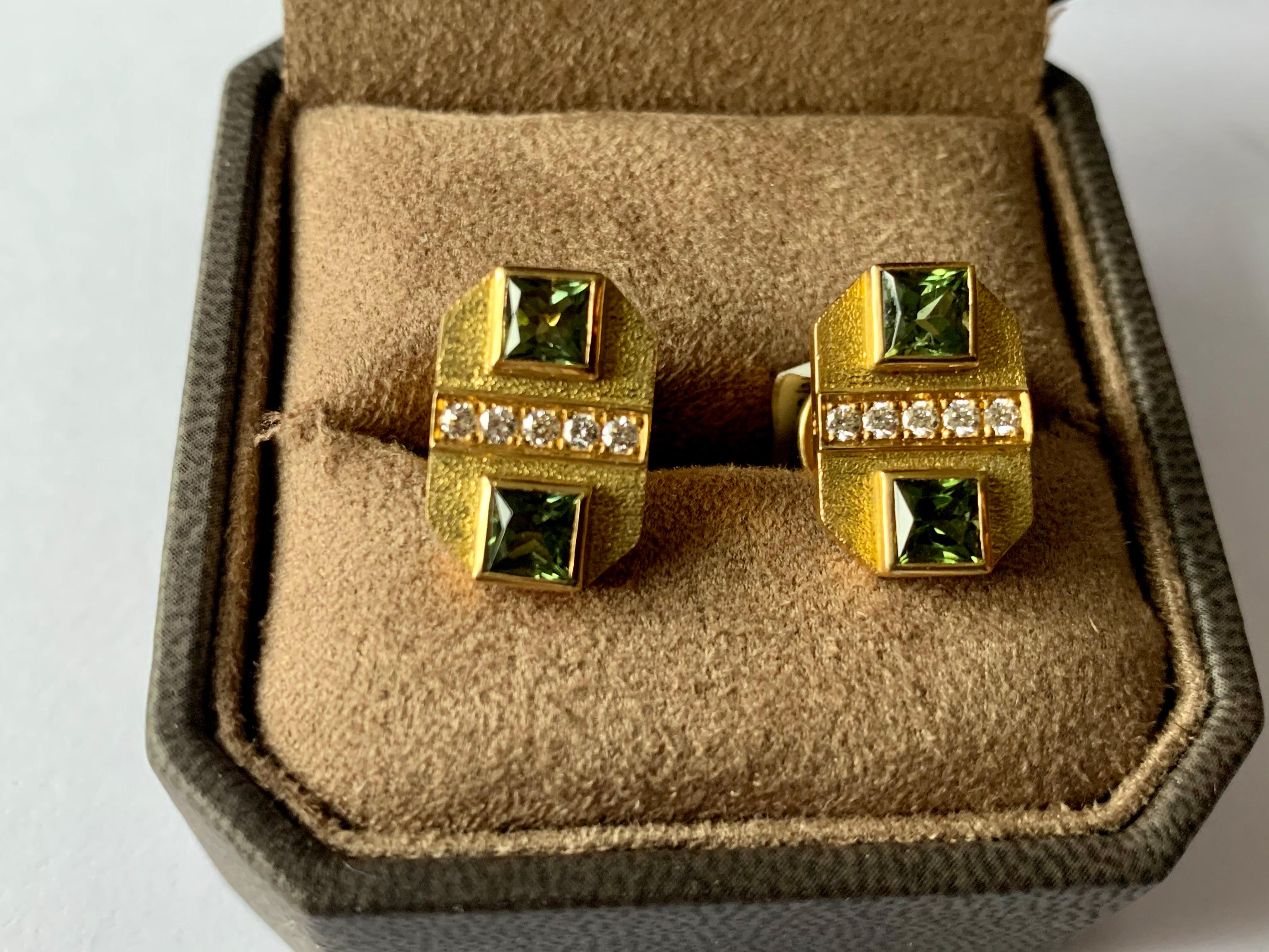 A pair of very attractive 18 K yellow Gold cufflinks featuring 4 green Tourmalines weighing 3.06 ct. accentuated by 10 brilliant cut Diamonds weighing 0.30 ct. The texture of the surface is delicately brushed and creates an understated look. The