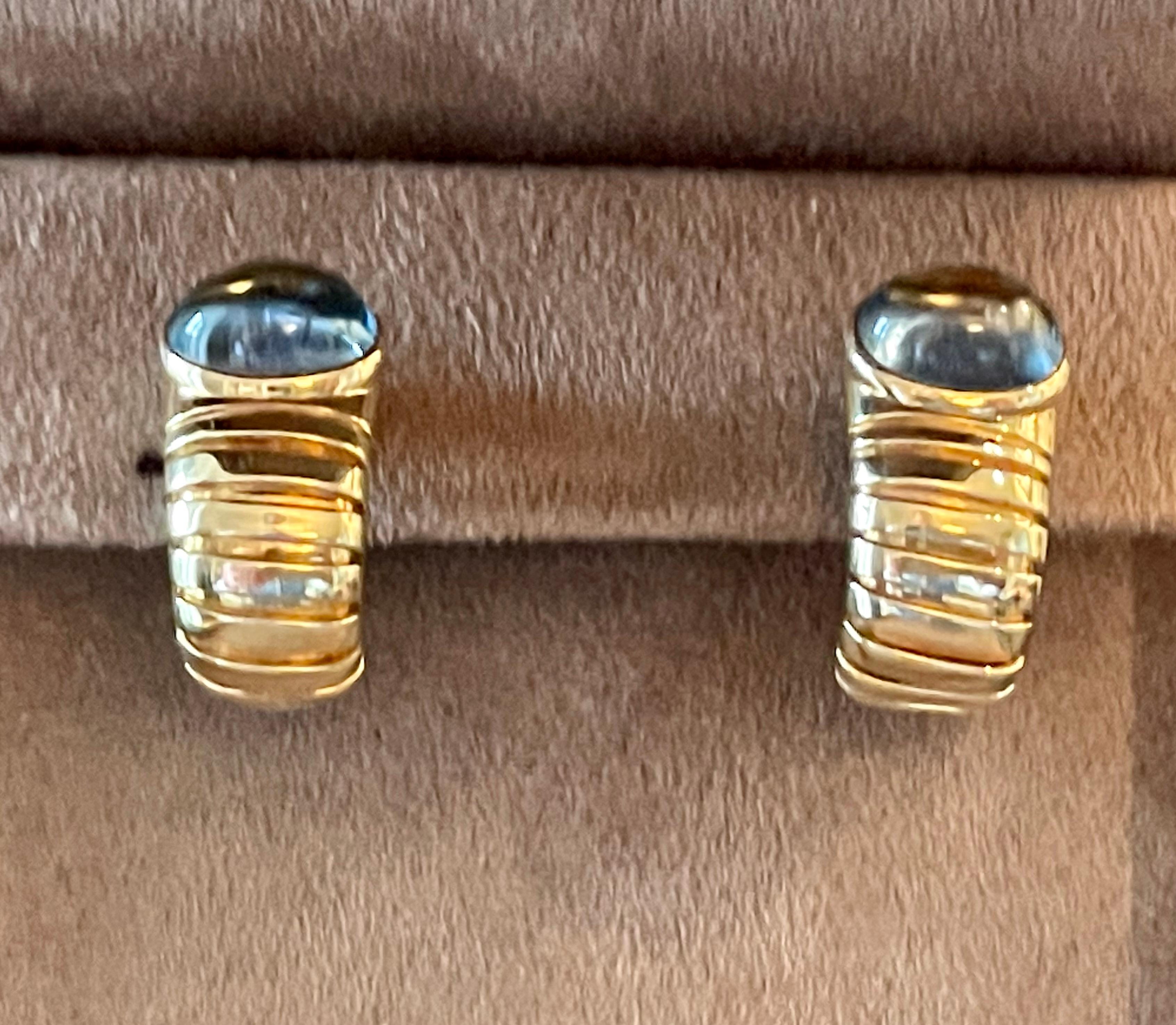 An iconic set of 18 K yellow Gold earclips showcasing 2blue Topaz Cabochons. 2.0 cm height and 1.5 cm wide. 23 grams. Stamped 750 with Italian assay marks for 18 karat gold
Fully signed Bvlgari, Made in Italy
QUESTIONS?  Contact us right away if you