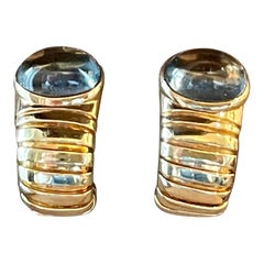 18 K yellow Gold Tubogas earclips Bulgari blue Topaz