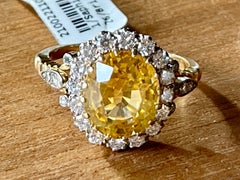 Bague d'entourage vintage en or jaune 18 carats avec saphir jaune et diamants