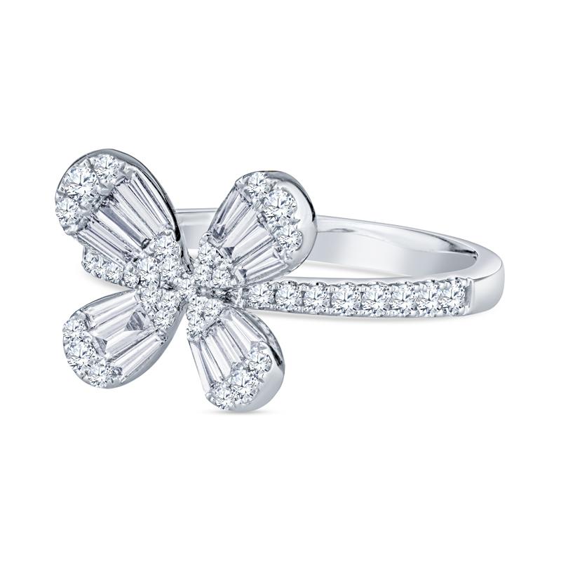 This floral ring features 0.70 carat total weight in baguette and round diamonds set in 18 karat white gold. This ring is a size 6.5 but can be resized upon request.
