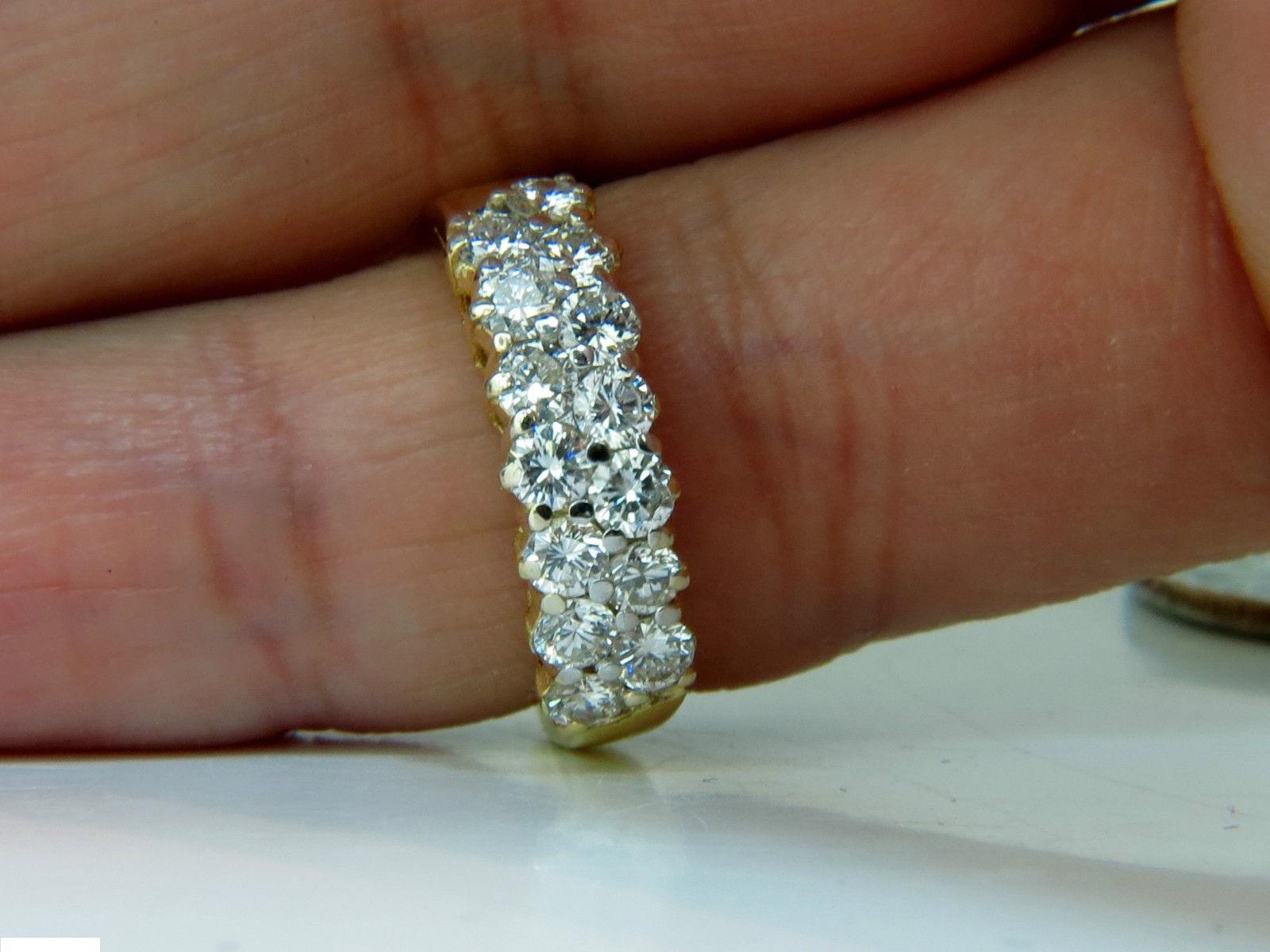 1.50ct. diamonds double row band.

14 diamonds in total

Gorgeous Ideal cut

G-color Vs-1 Vs-2 clairty

4.5 grams.

18kt. yellow gold

Size 4.5 (possible to resize, please inquire)

$5000 appraisal will accompany