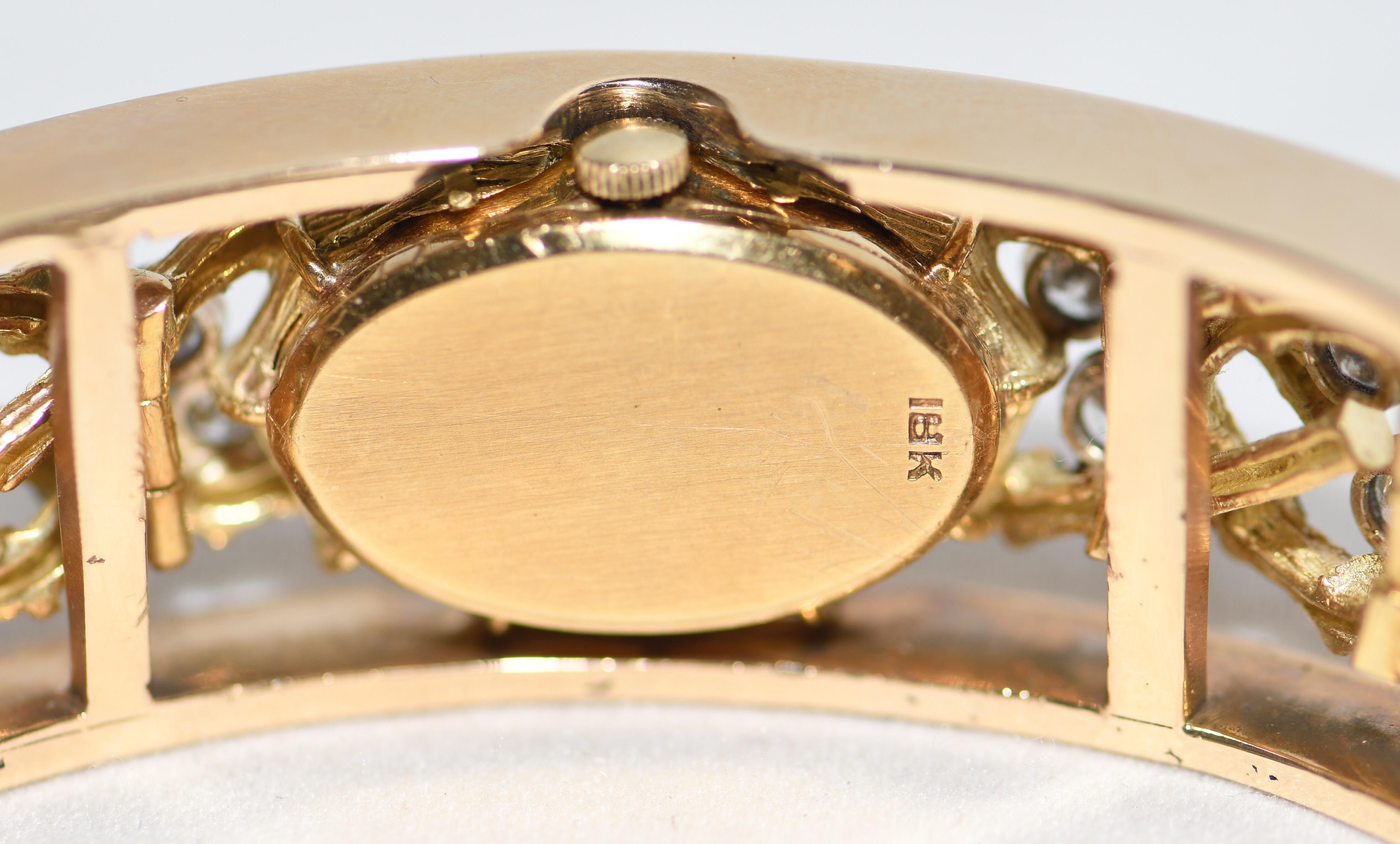 18 Karat 1980s Detailed Open Work Bangle with Diamond Face Watch For Sale 1