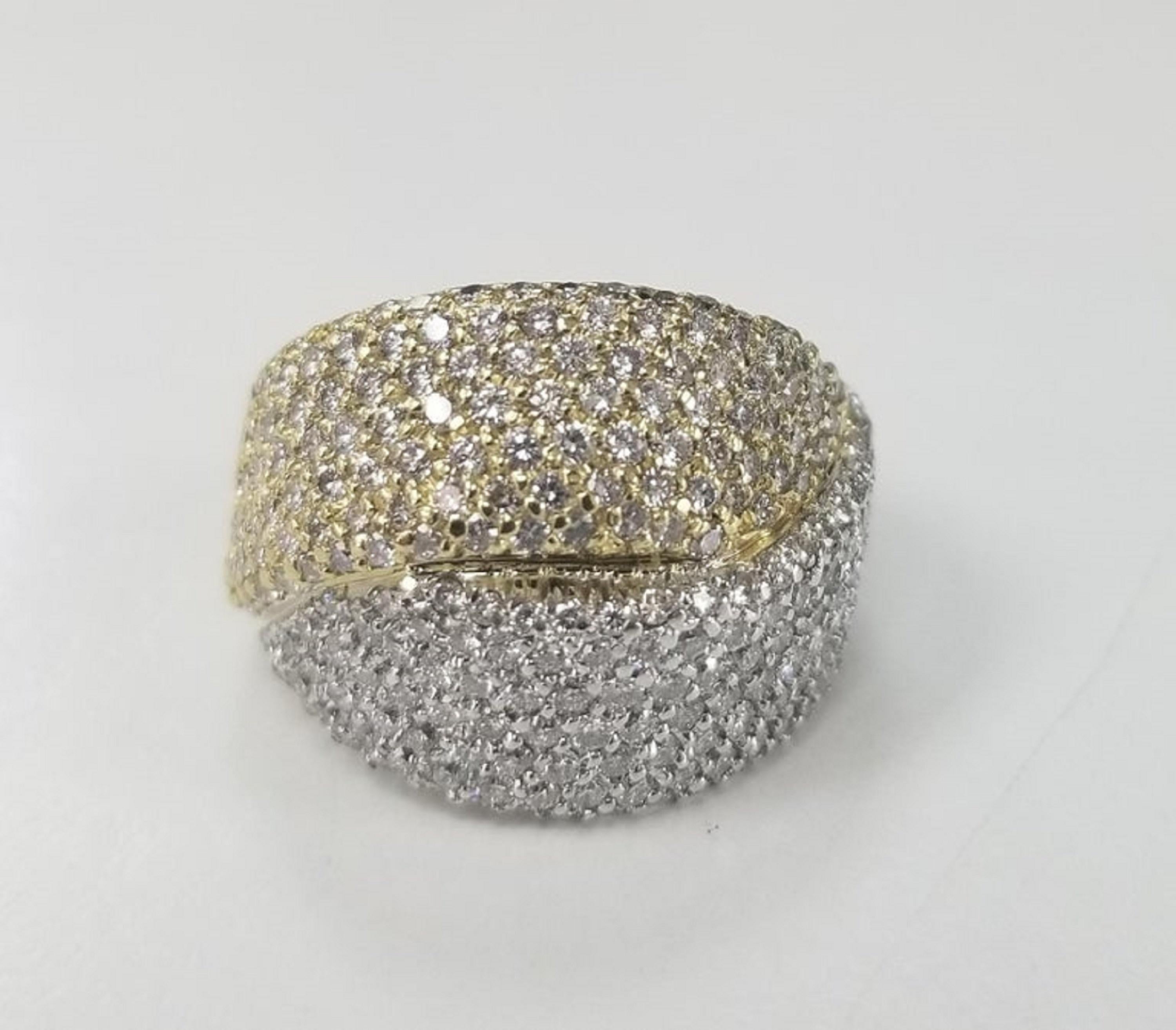 18 karat 2 tone diamond pave' ring, containing 322 round full cut diamonds of very fine quality, color 