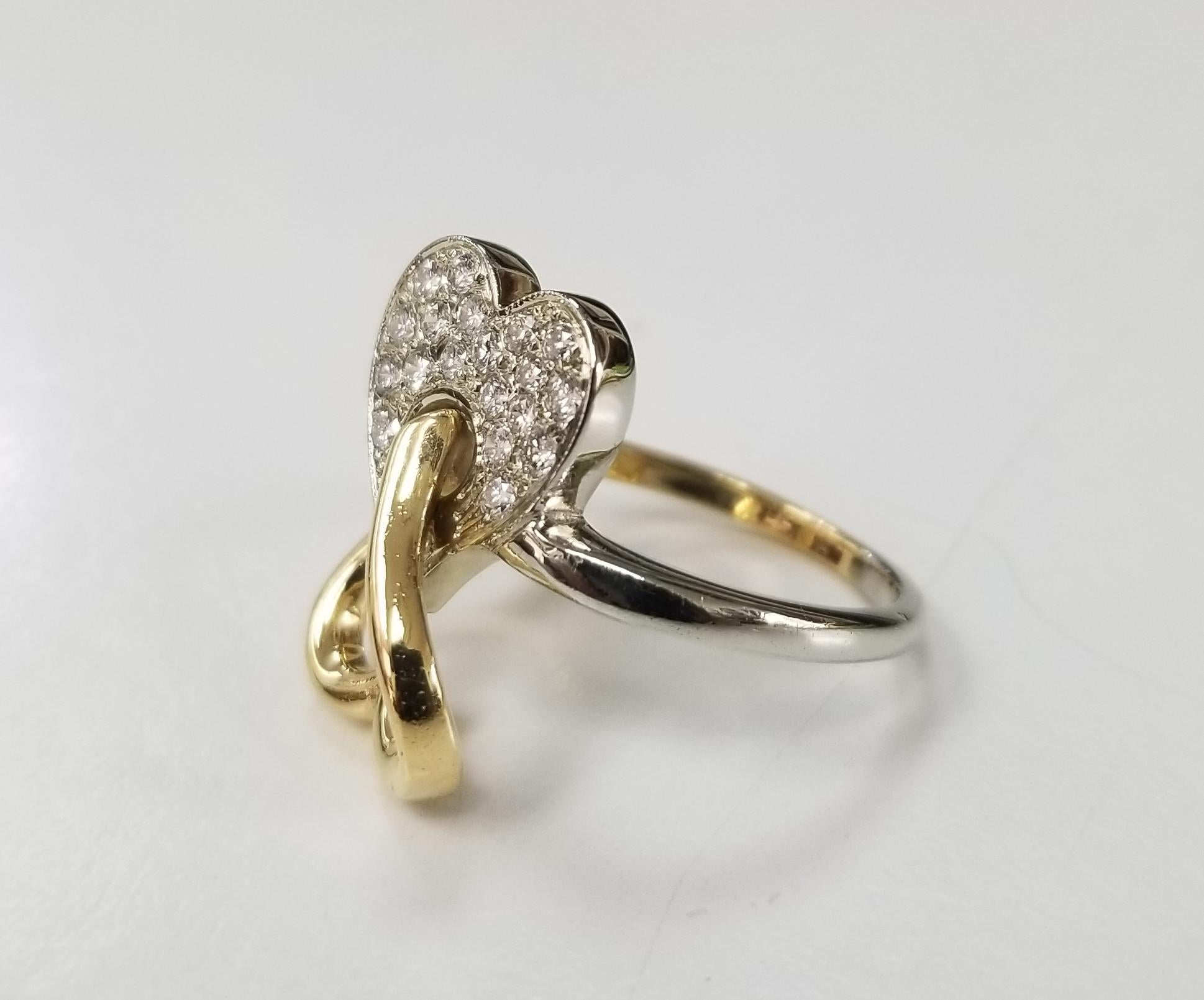 18 karat 2 tone diamond heart ring, containing 21 round full cut diamonds of very fine quality weighing .35pts.  the ring is 2 tone and a double heart.  ring is size 6 1/2 and can be sized to fit for free.