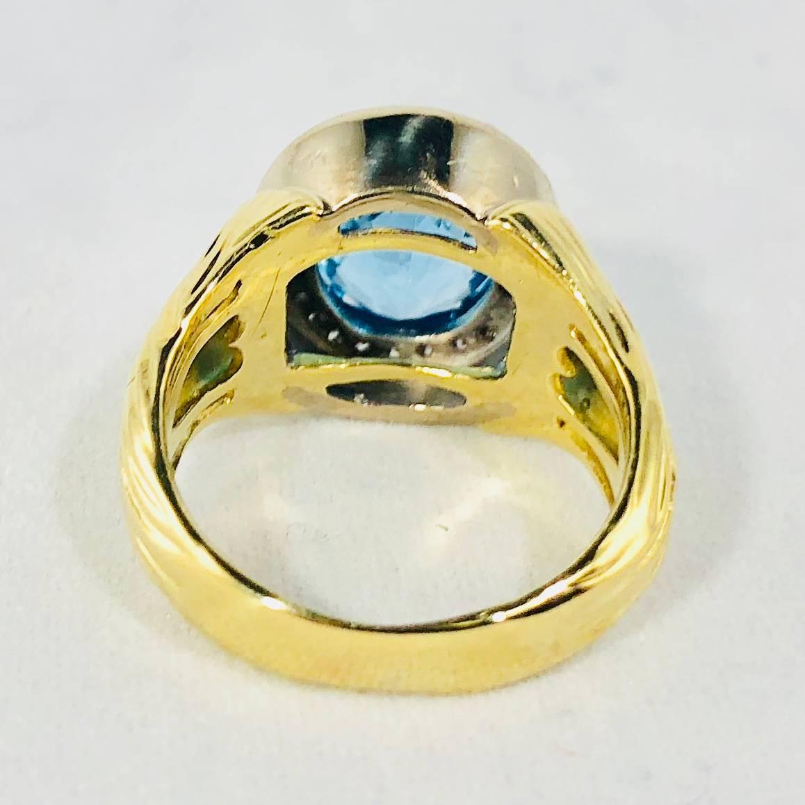 Oval Cut 18 Karat Two-Tone Yellow and White Gold Blue Topaz and Diamond Cocktail Ring