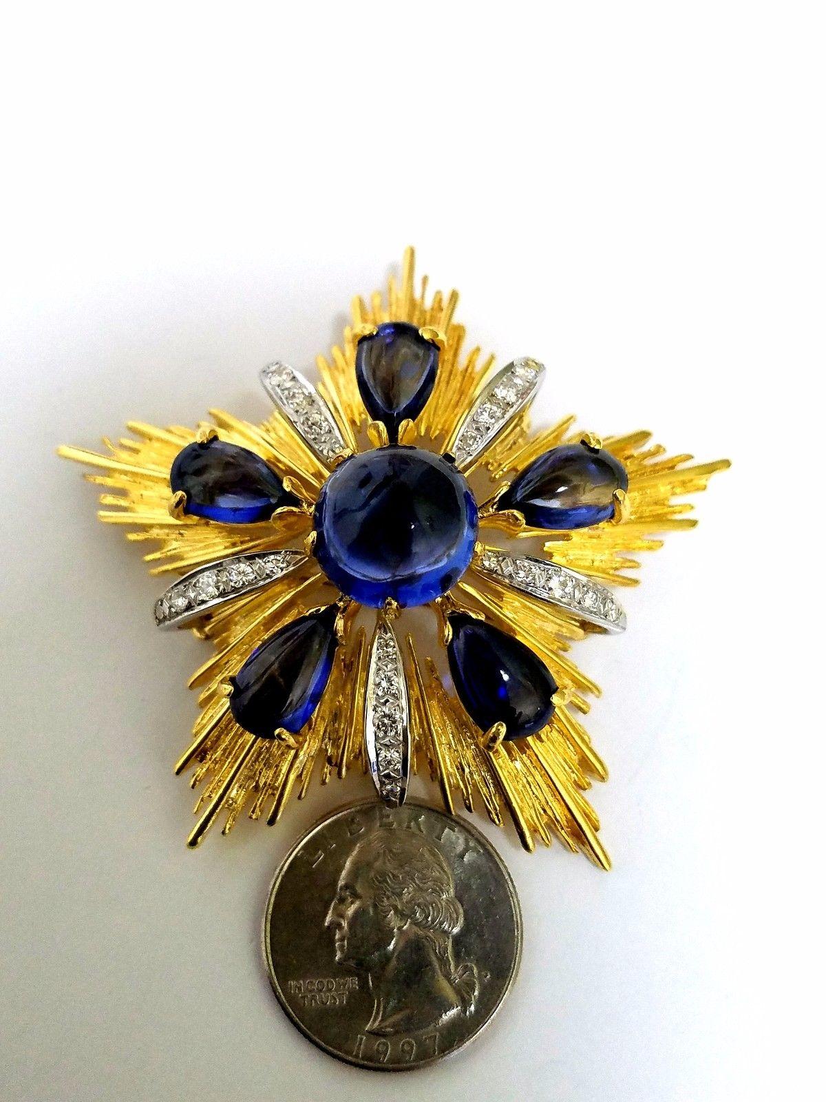 Raised Classic Starburst Royal Medallion
Brooch / Pin / Pendant / Pearl Enhancer / Ascot Knot
 40ct Processed Created Sapphires &
.60ct Natural Diamonds.
Rounds, Full cut Brilliant.
G-color VS-2 clarity.
18kt yellow gold 
intricate row details
57.5
