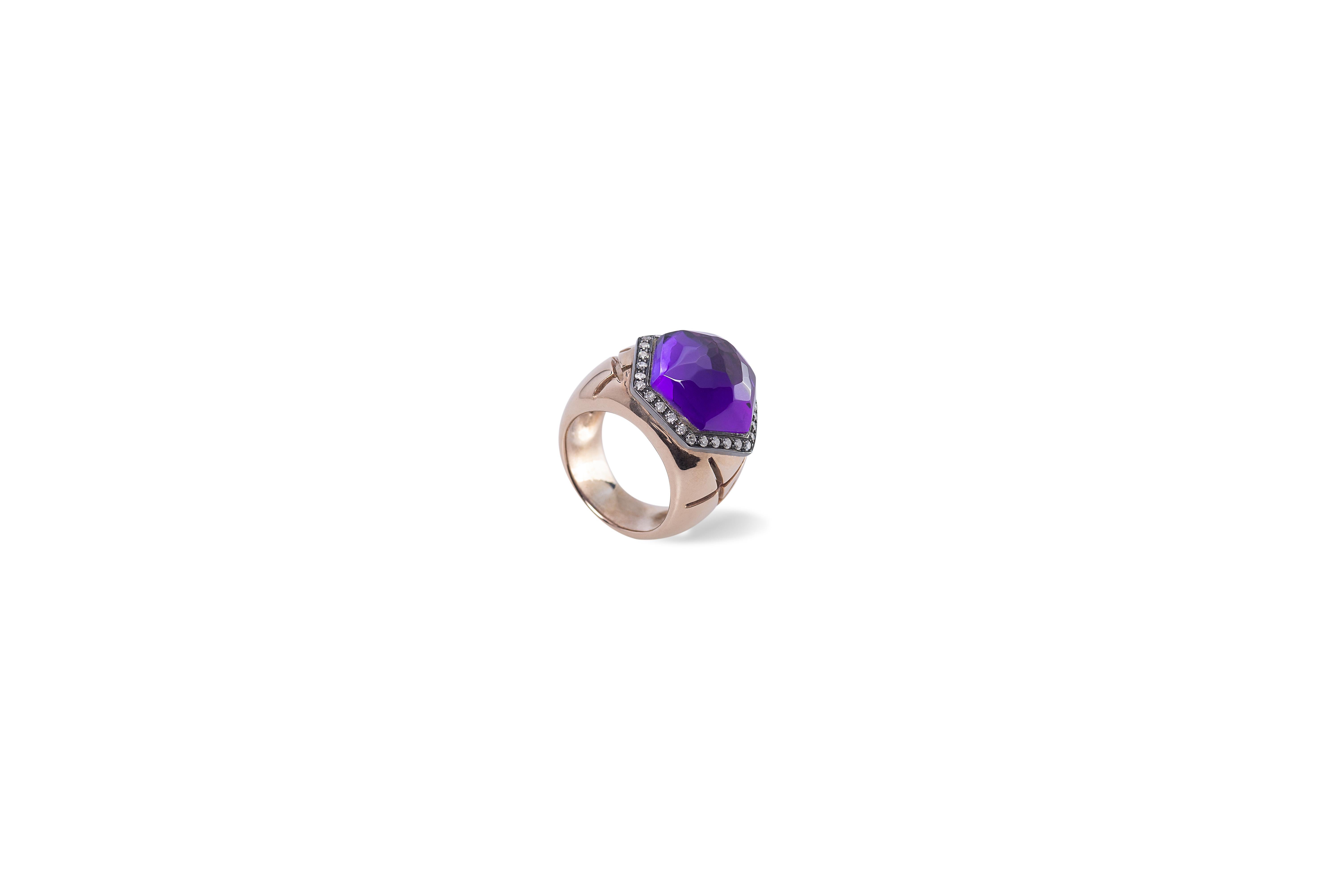 18 Karat Amethyst 0.40 Karat White Diamonds Rose Gold Exagonal Design Ring 
Here there is a beautiful design ring handcrafted in 18 karats rose gold and embellished with 0.40 karats brilliant cut white diamonds and a deep purple amethyst stone.