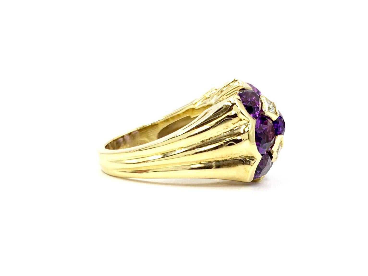 A substantial and well made 18 karat yellow gold dome ring featuring nine beautifully faceted oval amethysts and four round brilliant diamonds. Approximate diamond total weight is .28 carats at approximately G color, VS2 clarity. Stones are uniquely