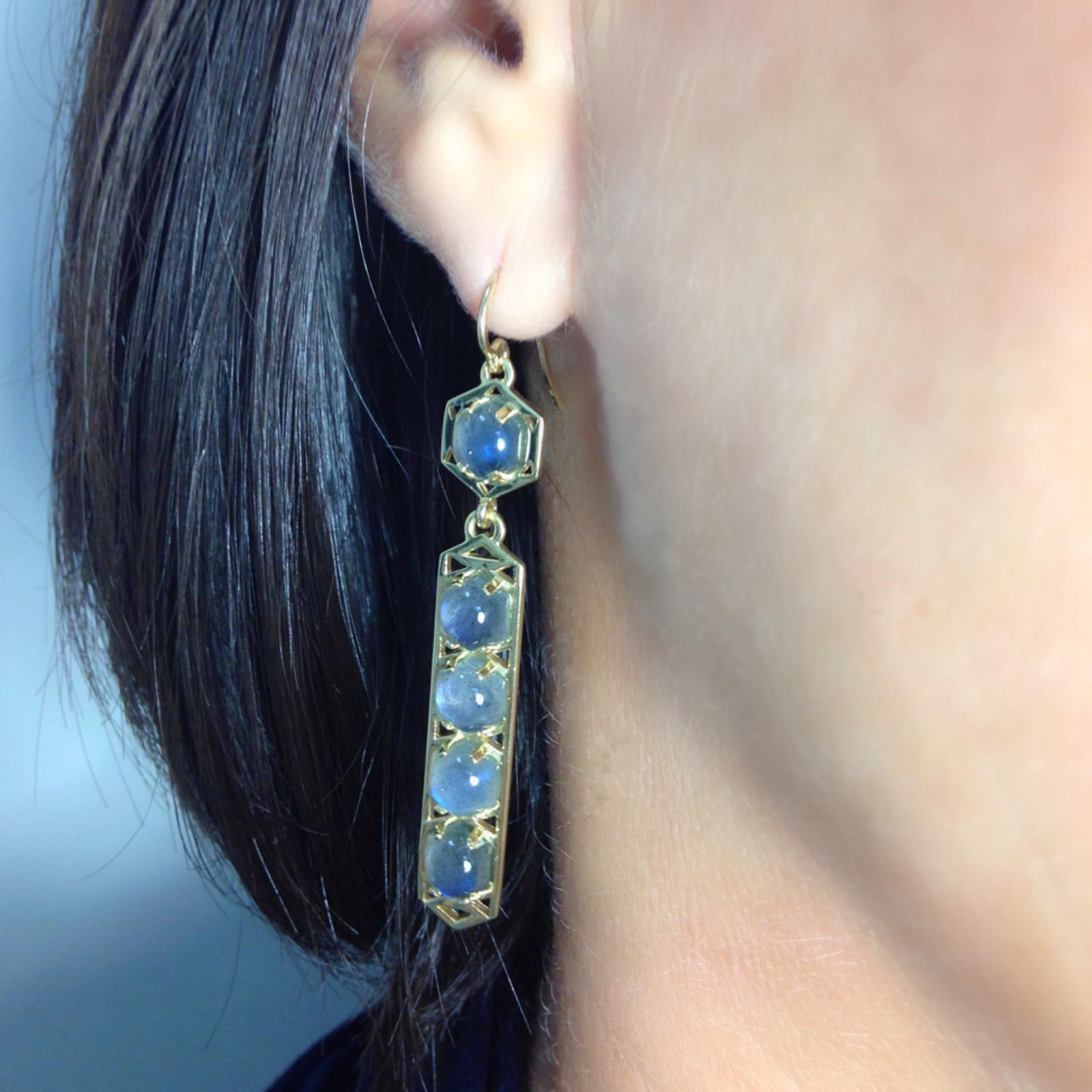 With modern geometry based on classical architectural forms, these 18 karat earrings feature custom cut 6mm hexagon Labradorites set in 18 Karat gold.  They feature a striking combination of luminous color against a bold geometric frame.
Materials: 