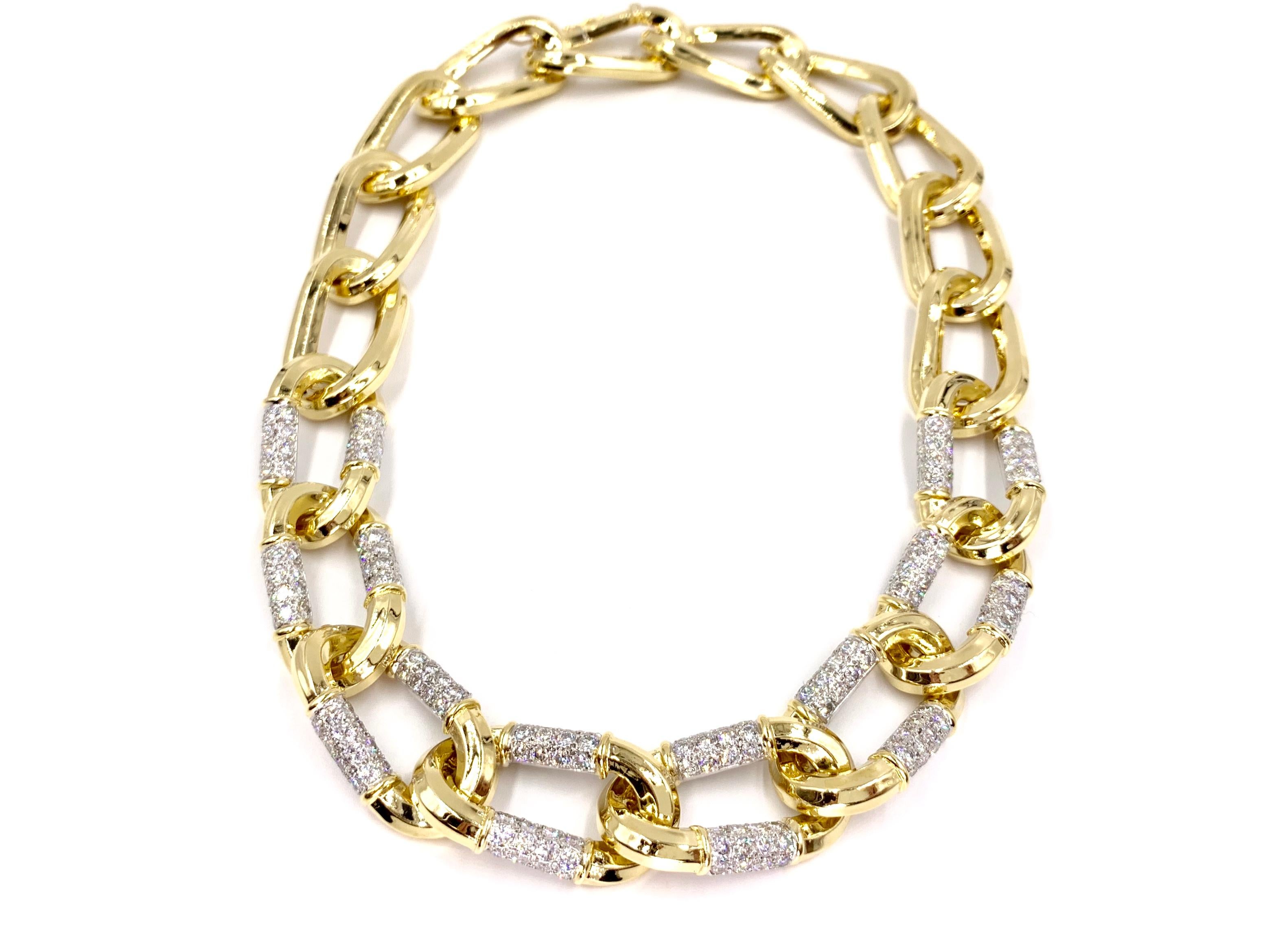 Heavy and substantial 18 karat yellow gold and platinum large interlocking oval link necklace featuring 192 round brilliant diamonds at 10.66 carats total weight. High quality diamonds are extremely brilliant at approximately E-F color, VVS1-VVS2