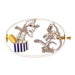 18 Karat and Platinum Diamond, Ruby, Sapphire and Enamel Jack in the Box Brooch