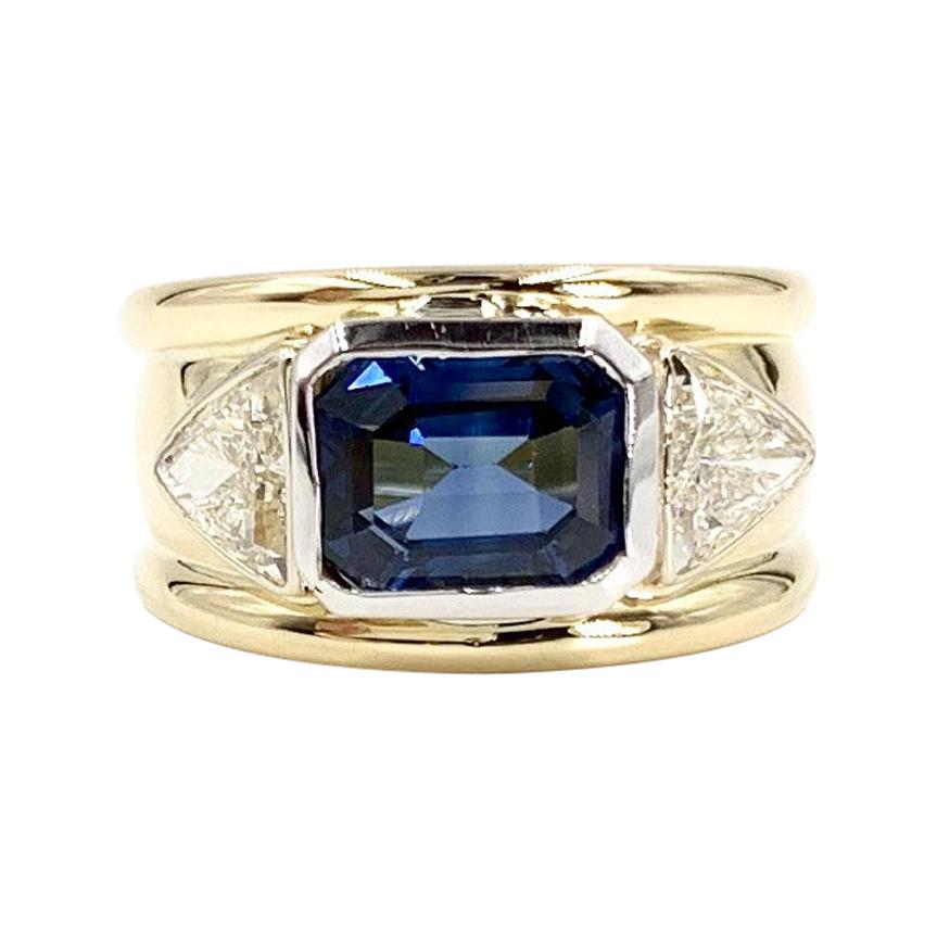 18 Karat and Platinum Three-Stone Blue Sapphire and Diamond Wide Ring For Sale