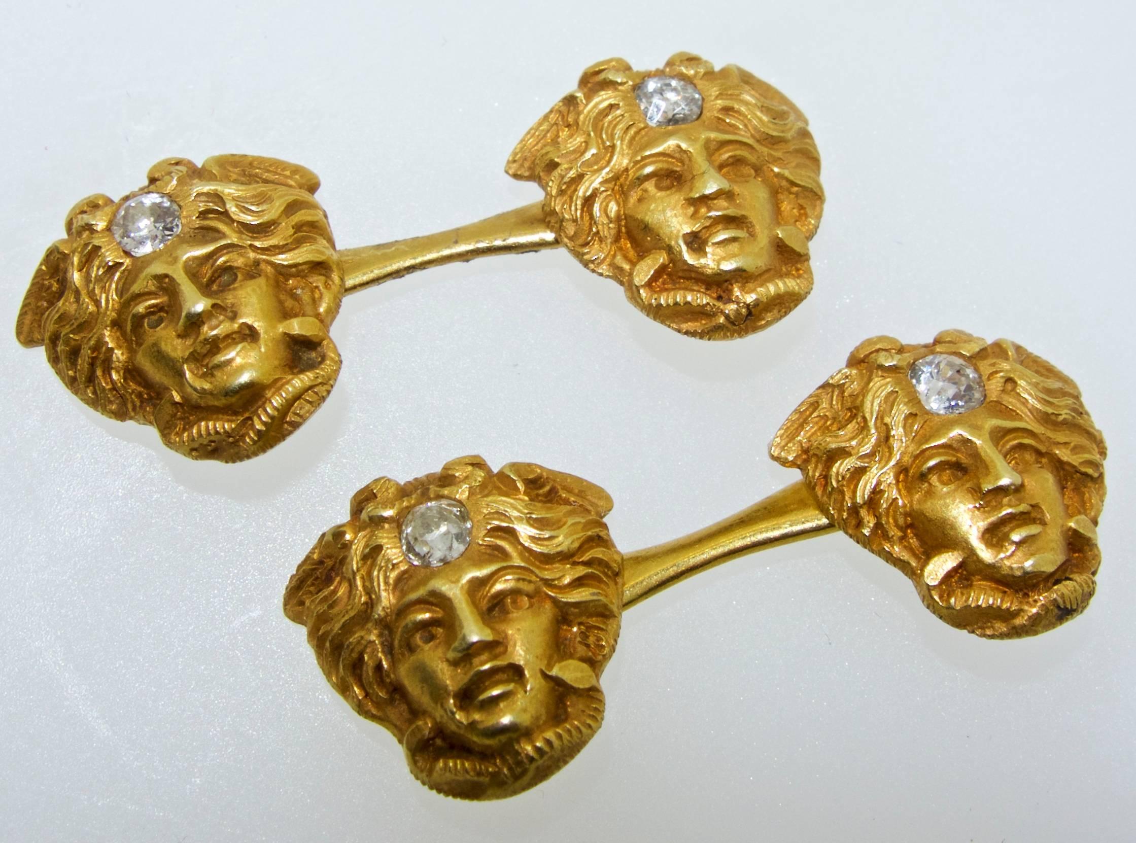 18K antique cufflinks of Medusa with a small diamond in the hair.  The diamond weigh is approximately .24 cts.  The medusa is about .50 inches across and well executed.  The connecting bar in the center is long so that it easier to put on and off. 