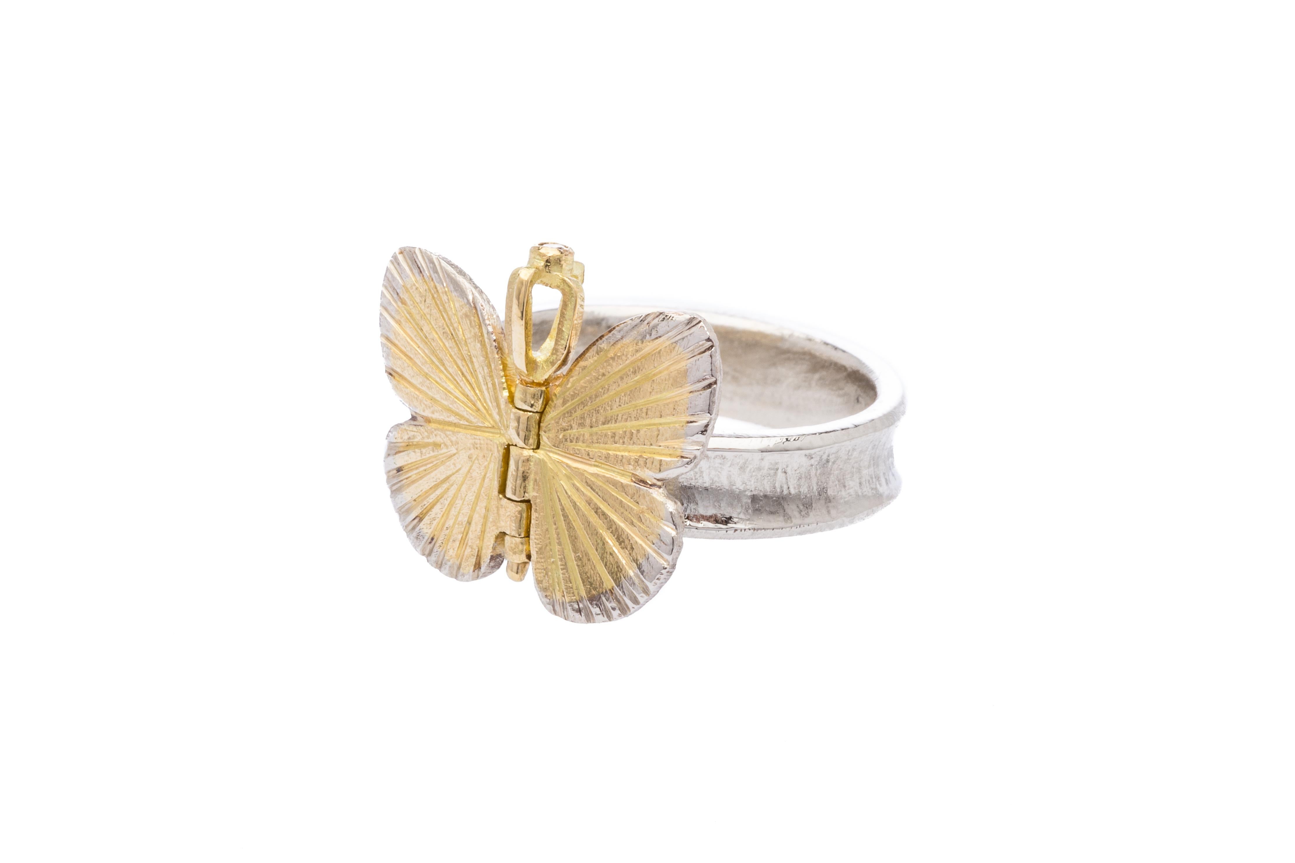 James Banks's signature butterfly ring features a Baby Asterope butterfly set in 18k Yellow Gold and 18k White Gold inlay, with a hinge in the center to allow movement of the wings topped with a solid gold crown, set on a thick 18k White Gold band.