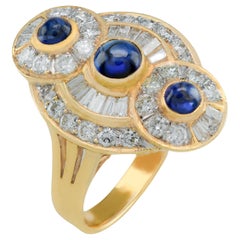 Vintage 18 Karat Baguette and Round Diamond Cabochon Sapphire Ring