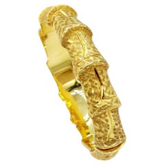 18 Karat Bamboo Carved Plain Gold Oval Hinged Bangle with Hidden Clasp