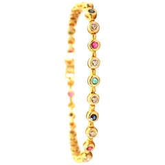 18 Karat Bezel Set Diamonds Emeralds Rubies and Sapphires Inline Tennis Bracelet
