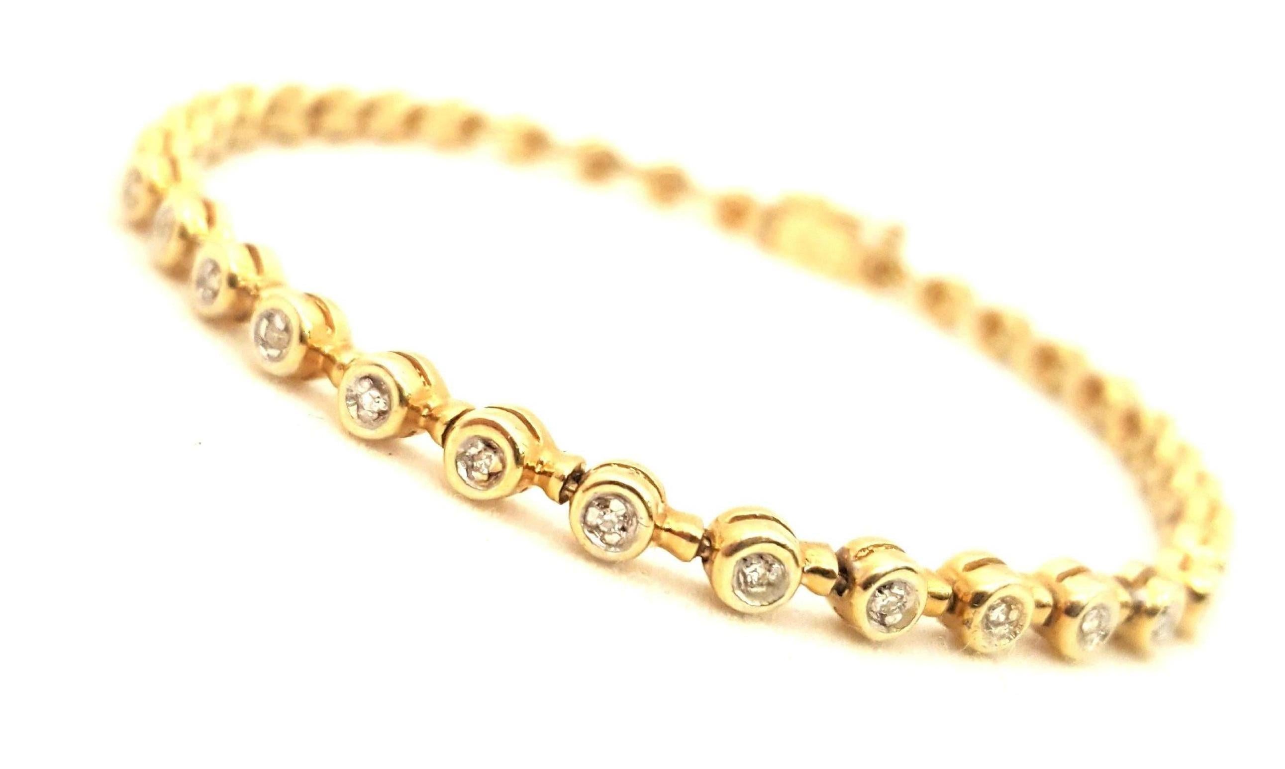 What is the perfect bracelet to wear with your wristwatch or stack with other similar items??  A classic inline tennis bracelet!  This beauty in 18 karat yellow gold features 36 matched round white bezel set diamonds with an approximate total weight